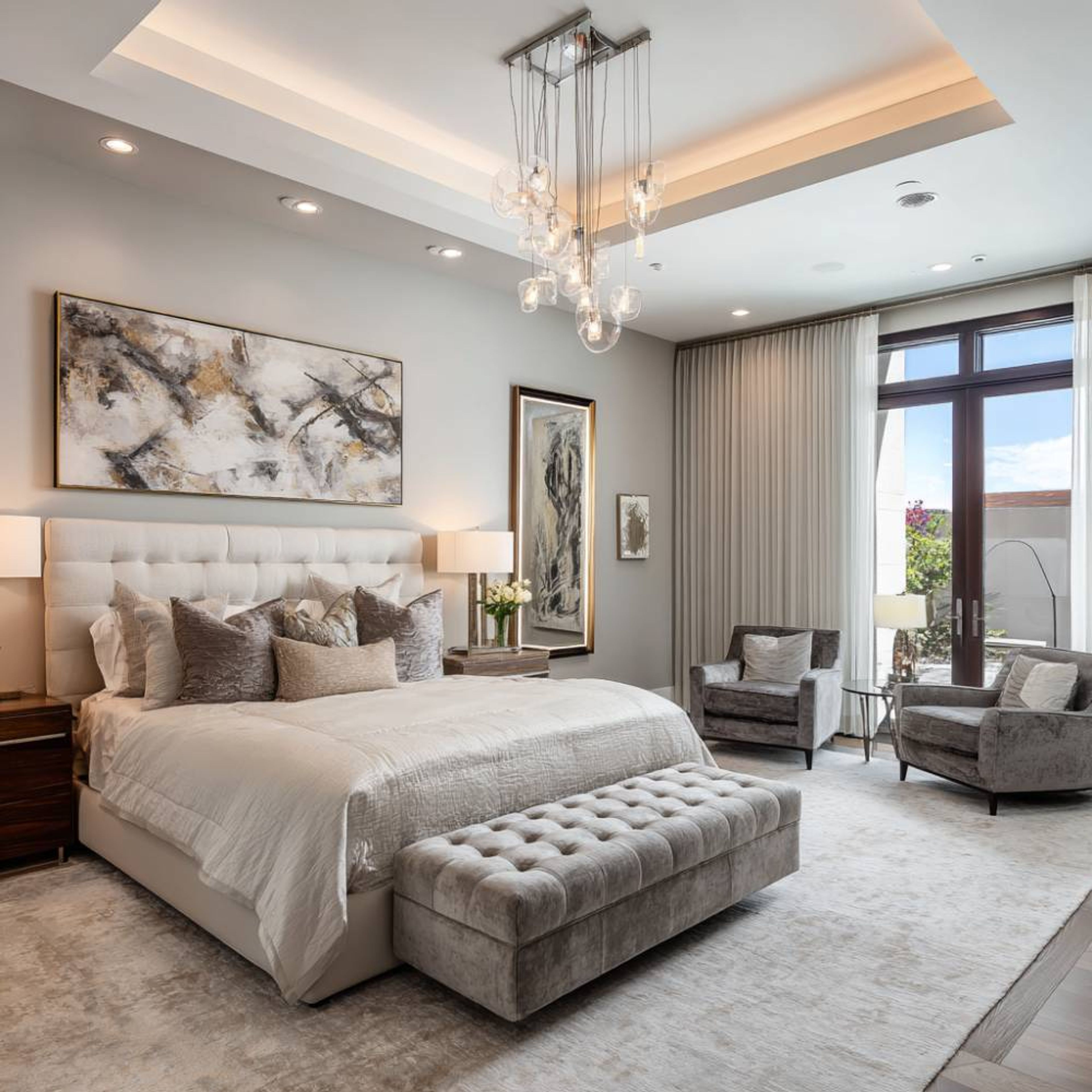 Modern Master Bedroom Design with King Bed Ottoman Artwork and Tray Ceiling