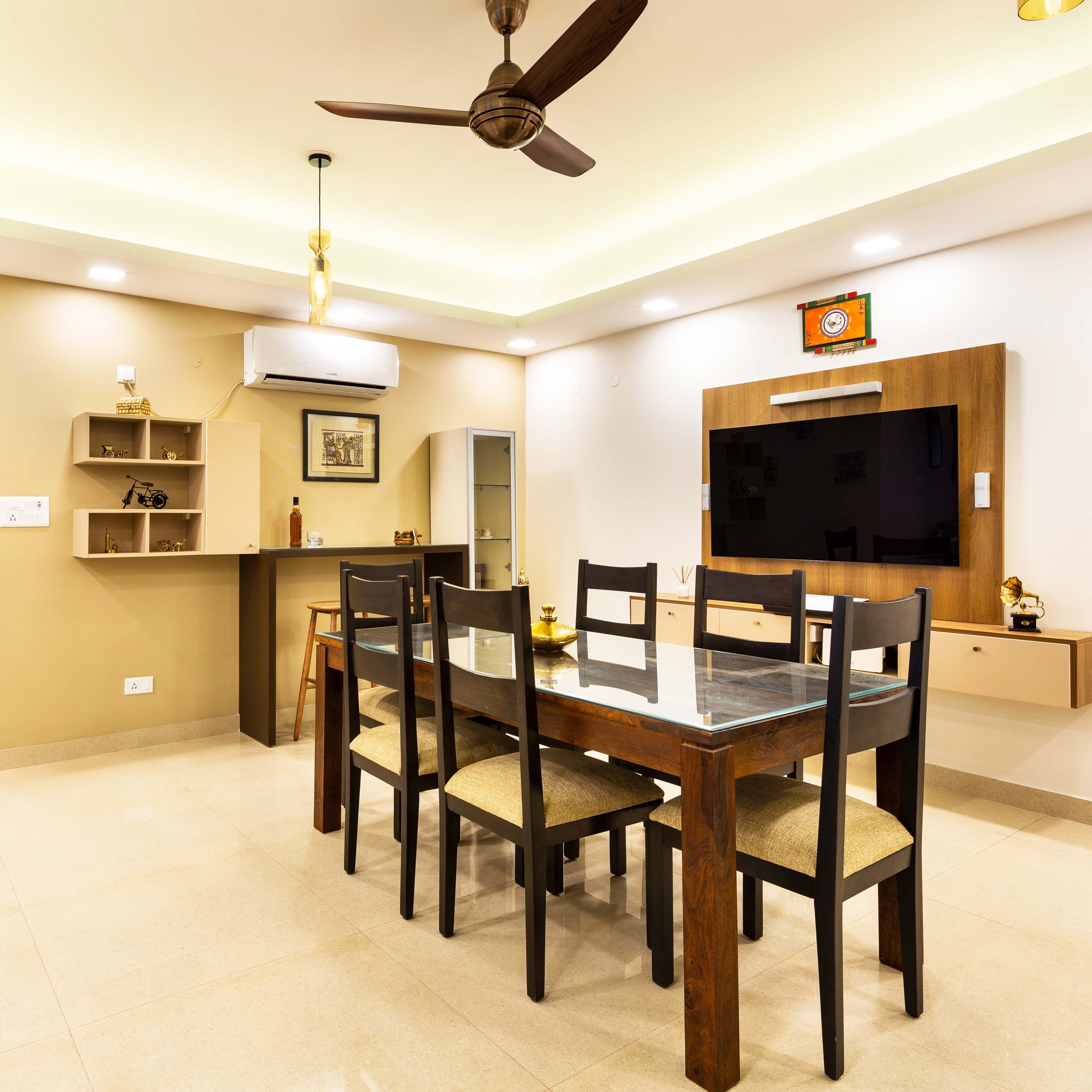 6-Seater Dining Room Design With A Glass Tabletop And A Bar Unit - Livspace