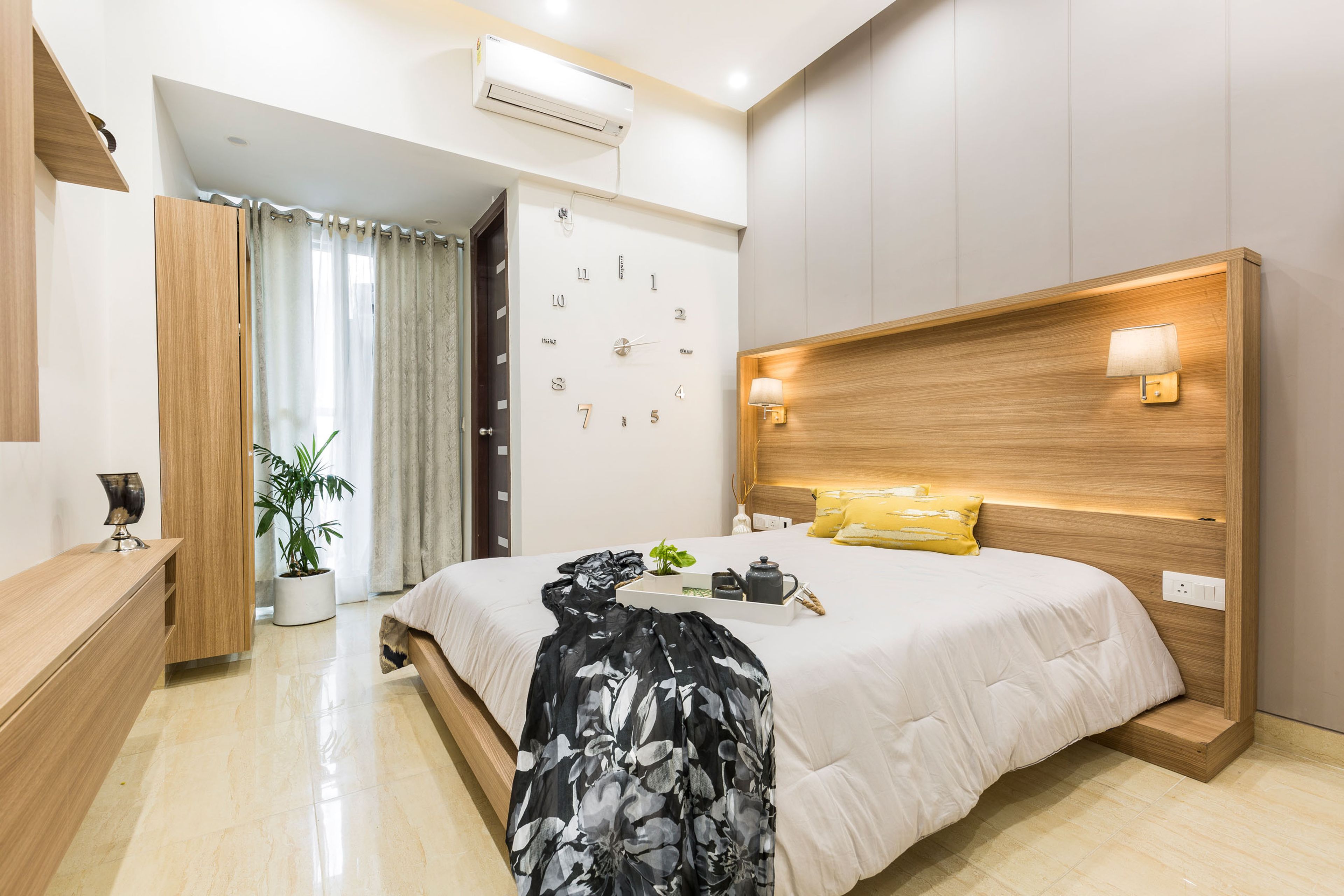 Classic Guest Room Design With Large Wooden Headboard