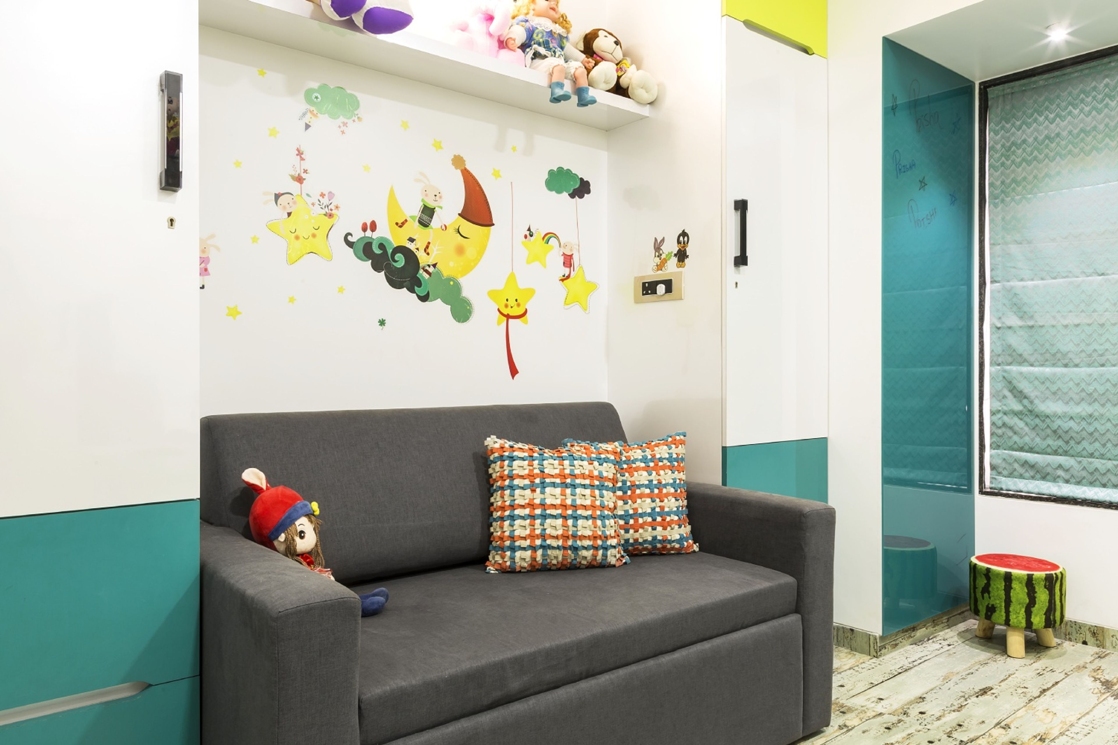 Modern Kids Room Design With A Grey Upholstered Sofa