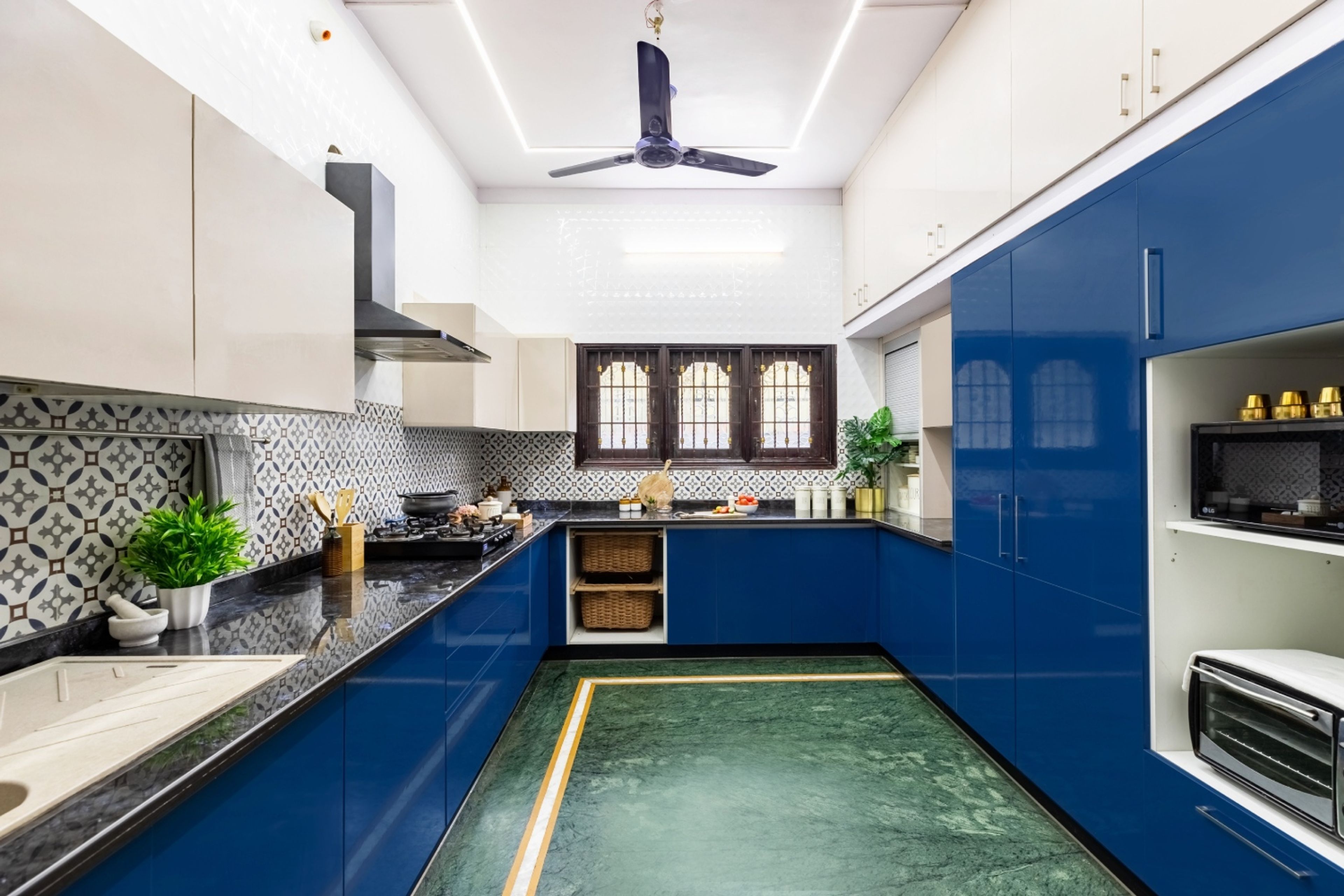 Modern U-Shaped Kitchen Design With Blue And Grey Kitchen Cabinets