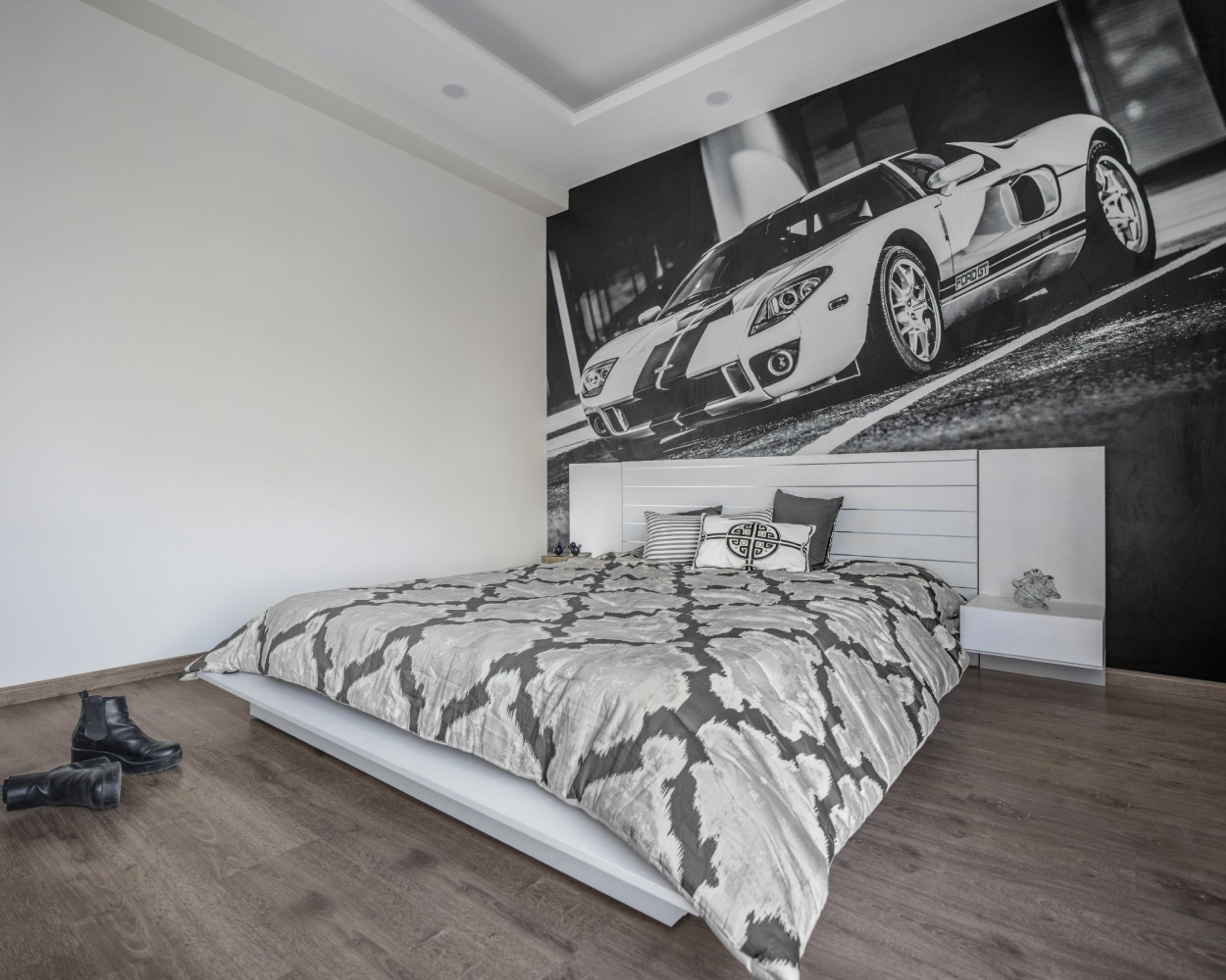 Neutral-Tone Bedroom Wallpaper With A Car Mural - Livspace