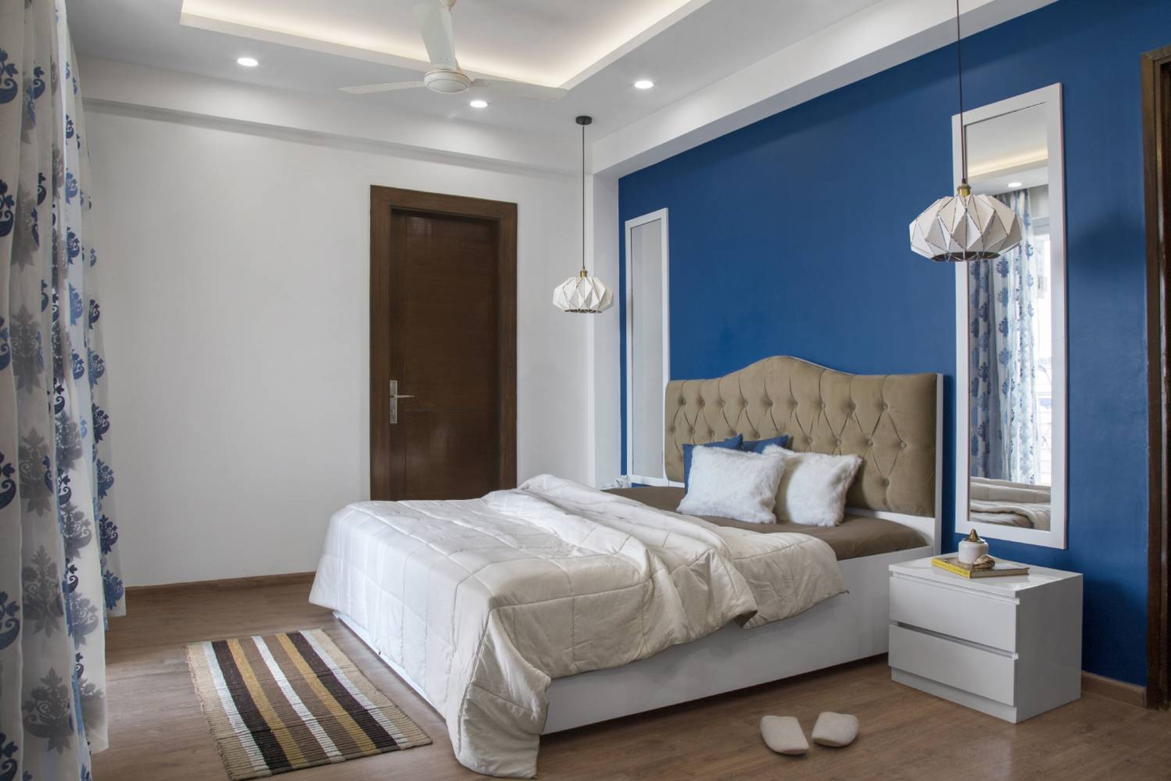 Master Bedroom Design with Blue Wall and Wooden Flooring