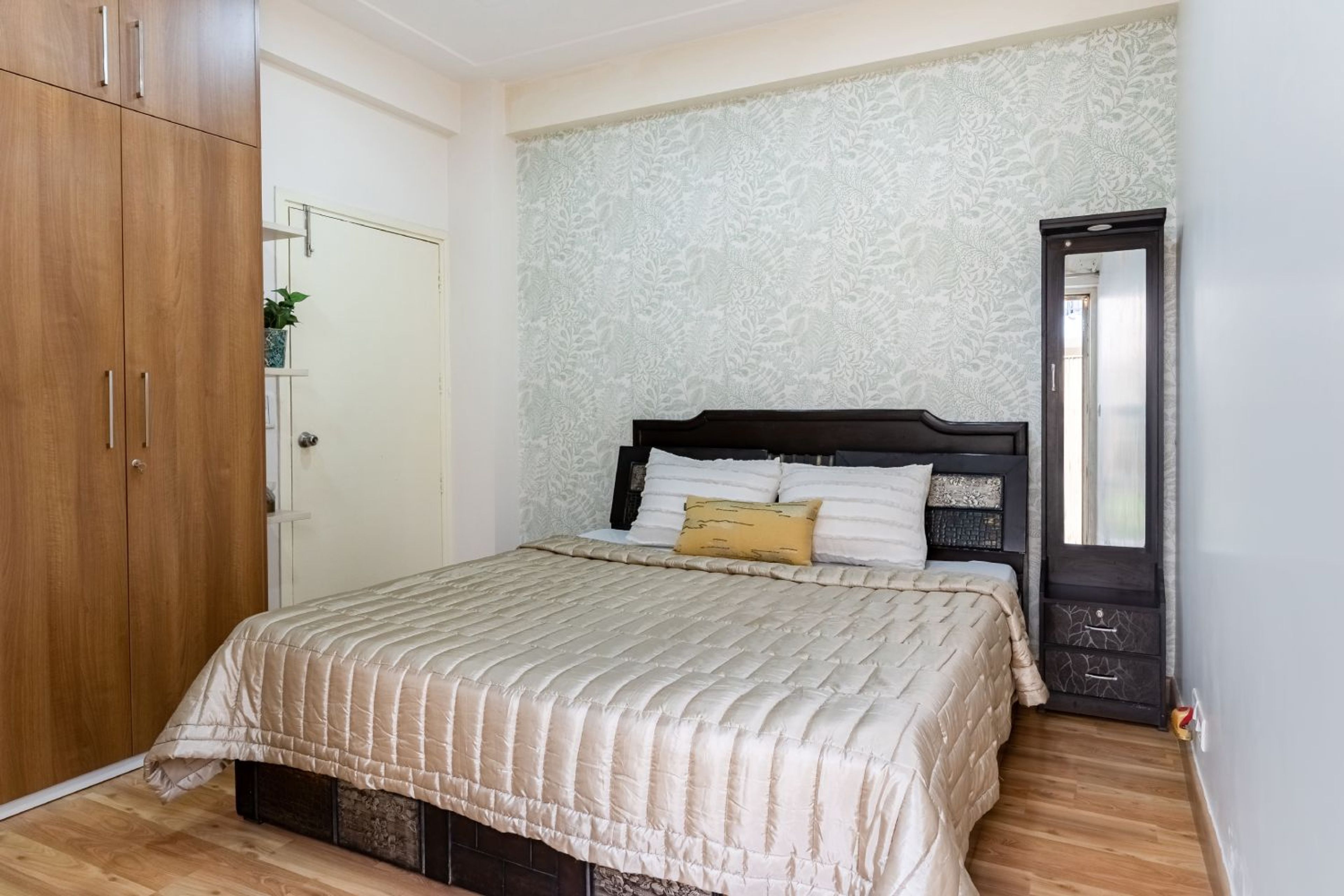 Guest Bedroom Design with Leaves Themed Wallpaper