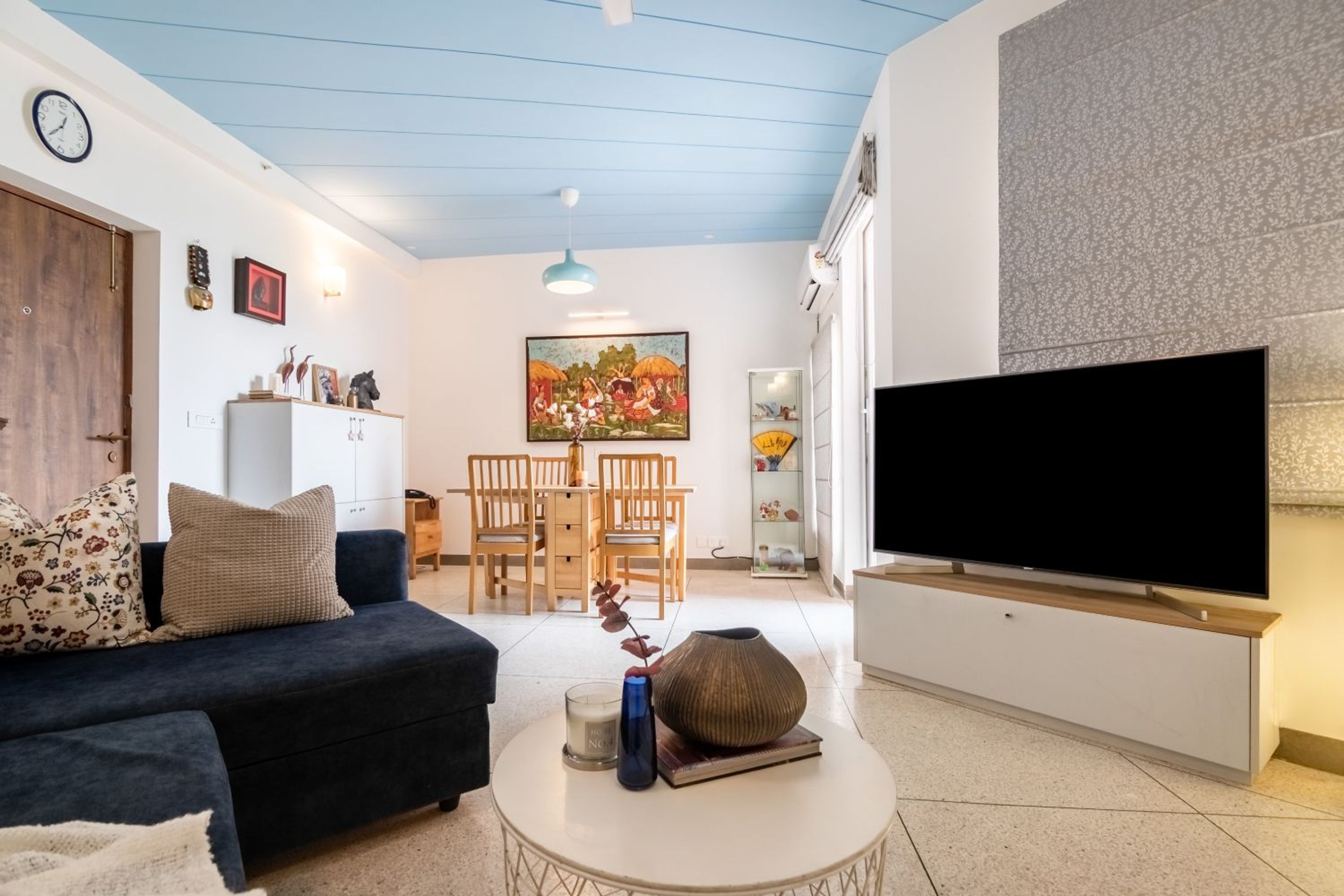 Living Cum Dining Room Design with TV Unit