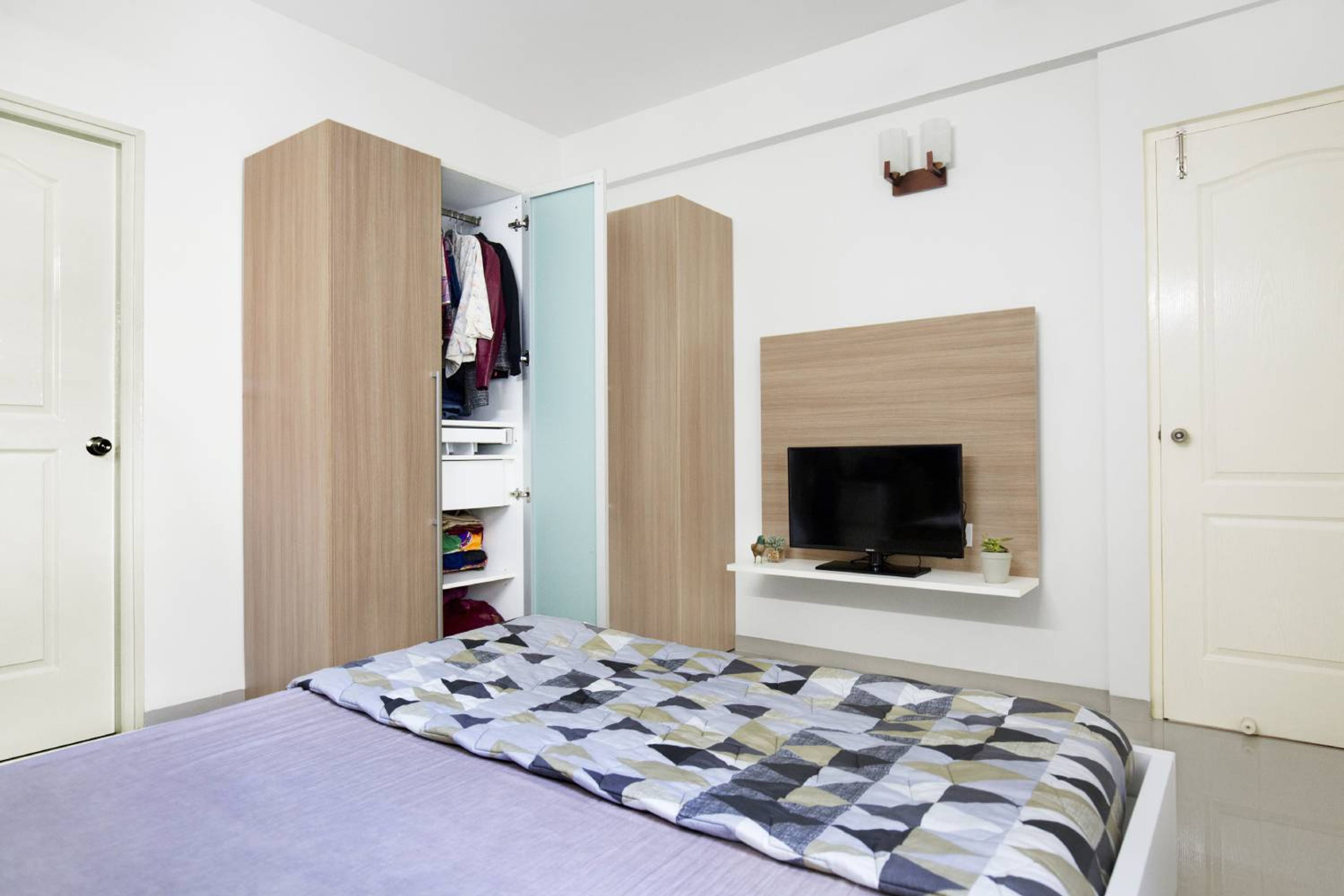 Master Bedroom Design with Wooden 4-Door Swing Wardrobe