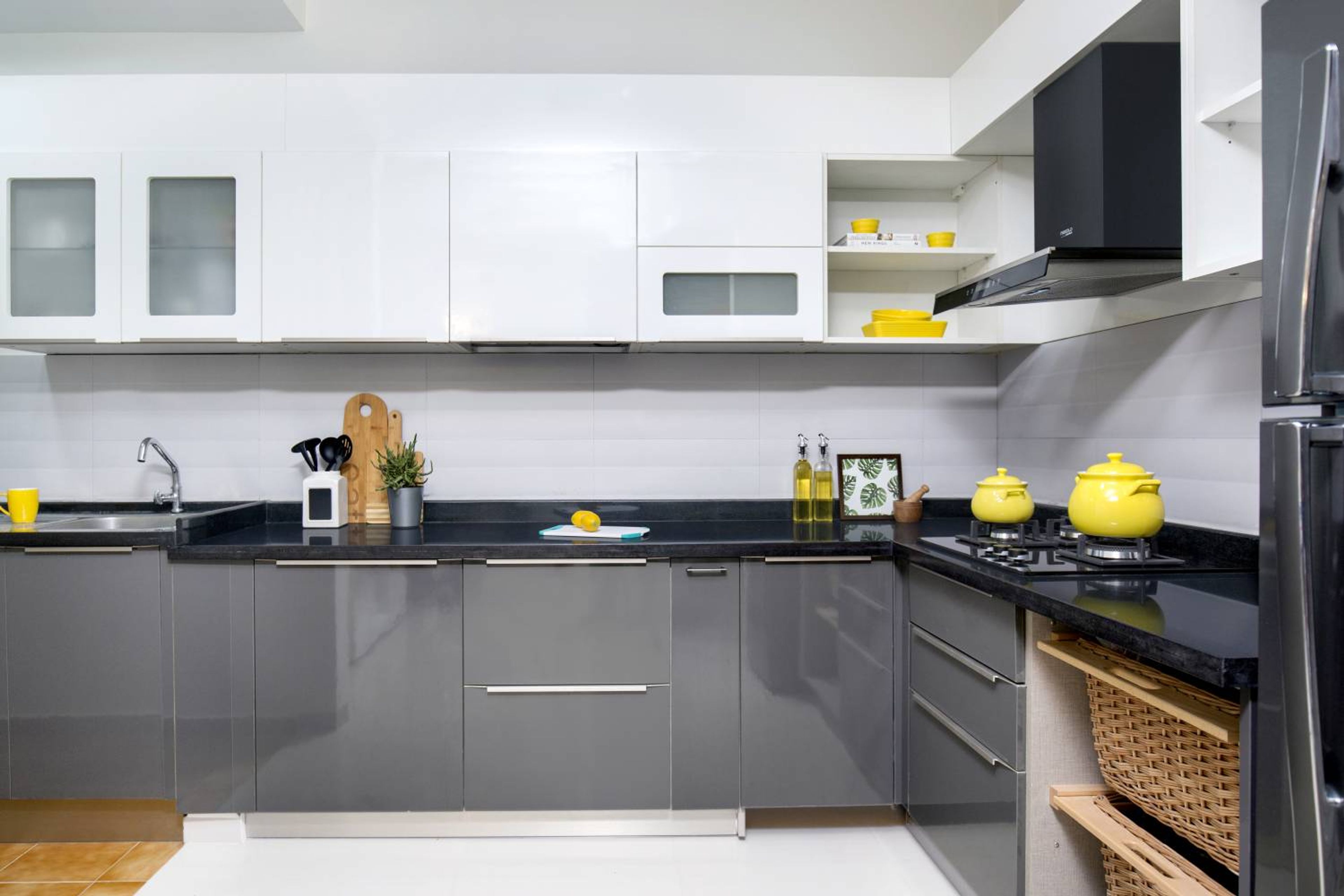 Inviting and Modern 2BHK Flat Design with L-Shaped Kitchen and Swing Wardrobes