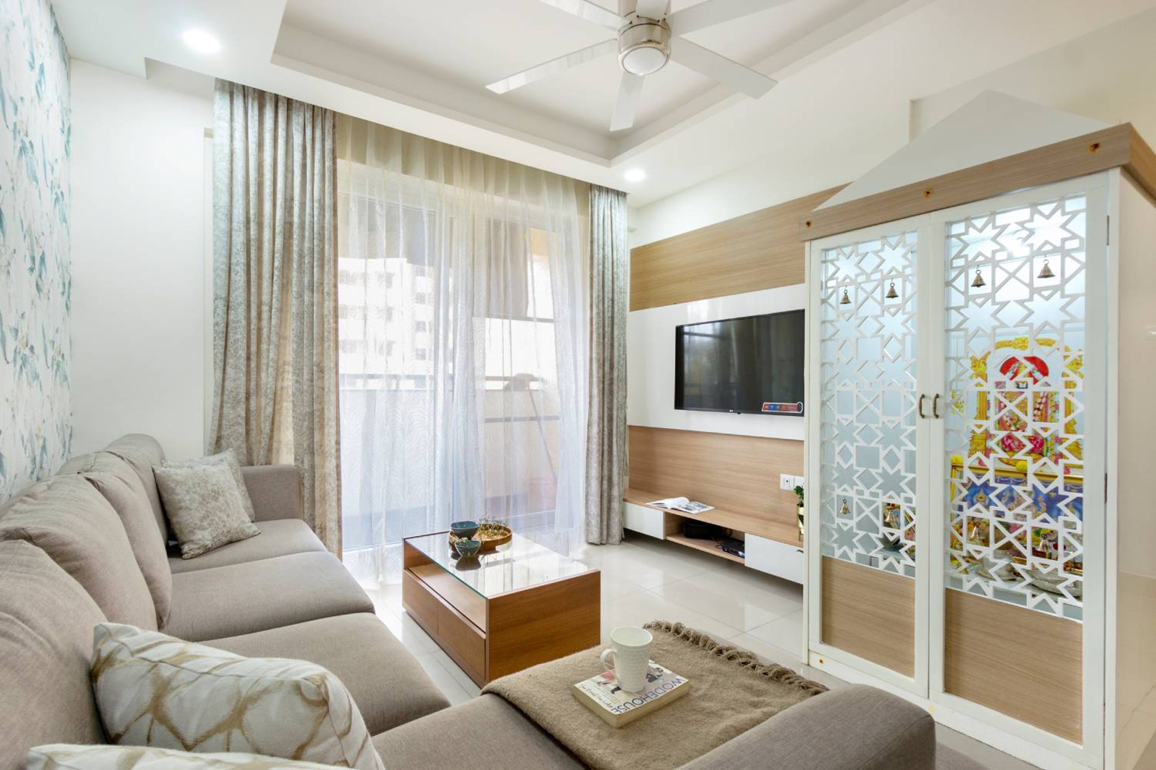 Living Room Design with Closed Pooja Unit