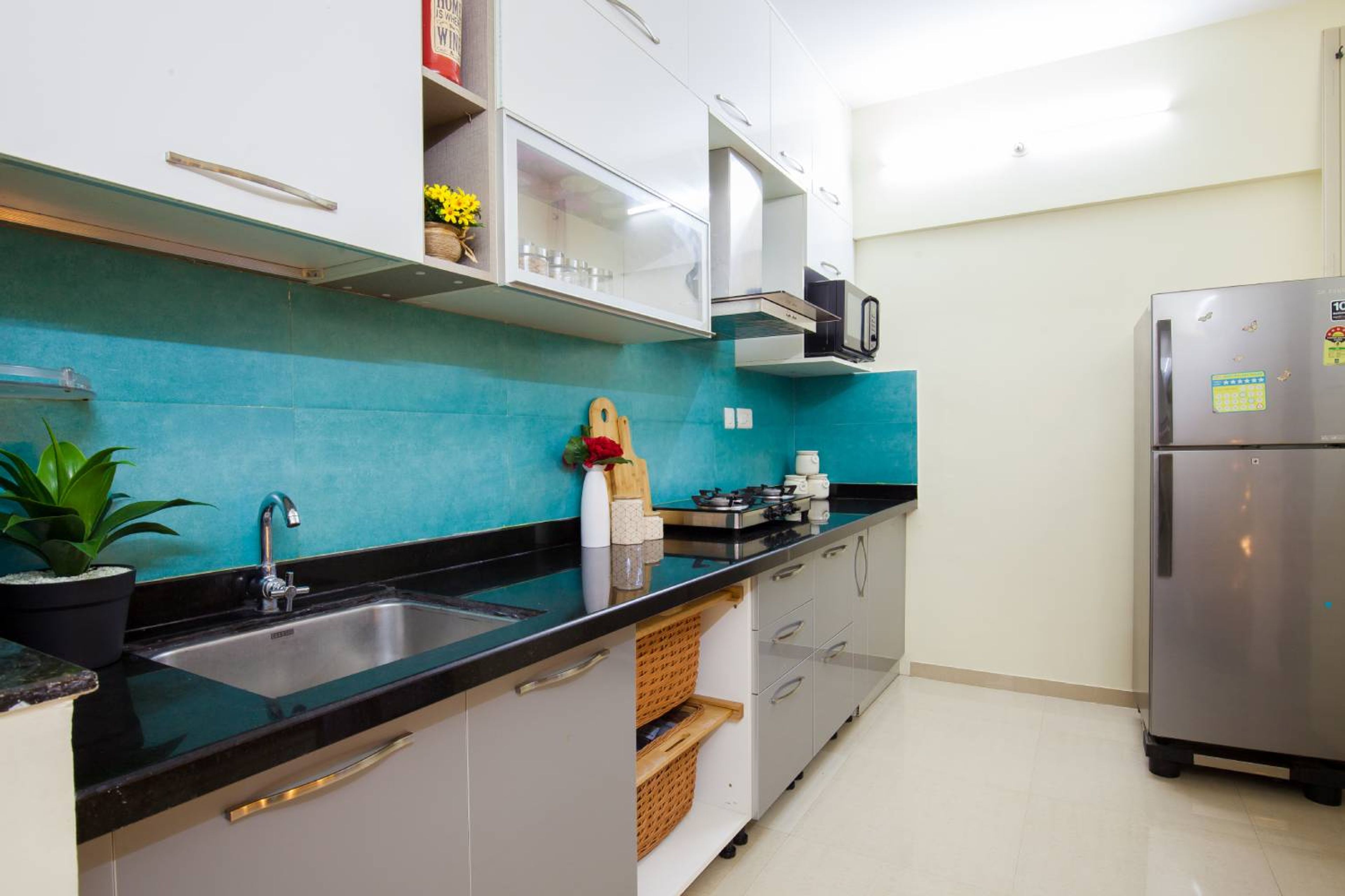 Straight Kitchen Design with Blue Backsplash