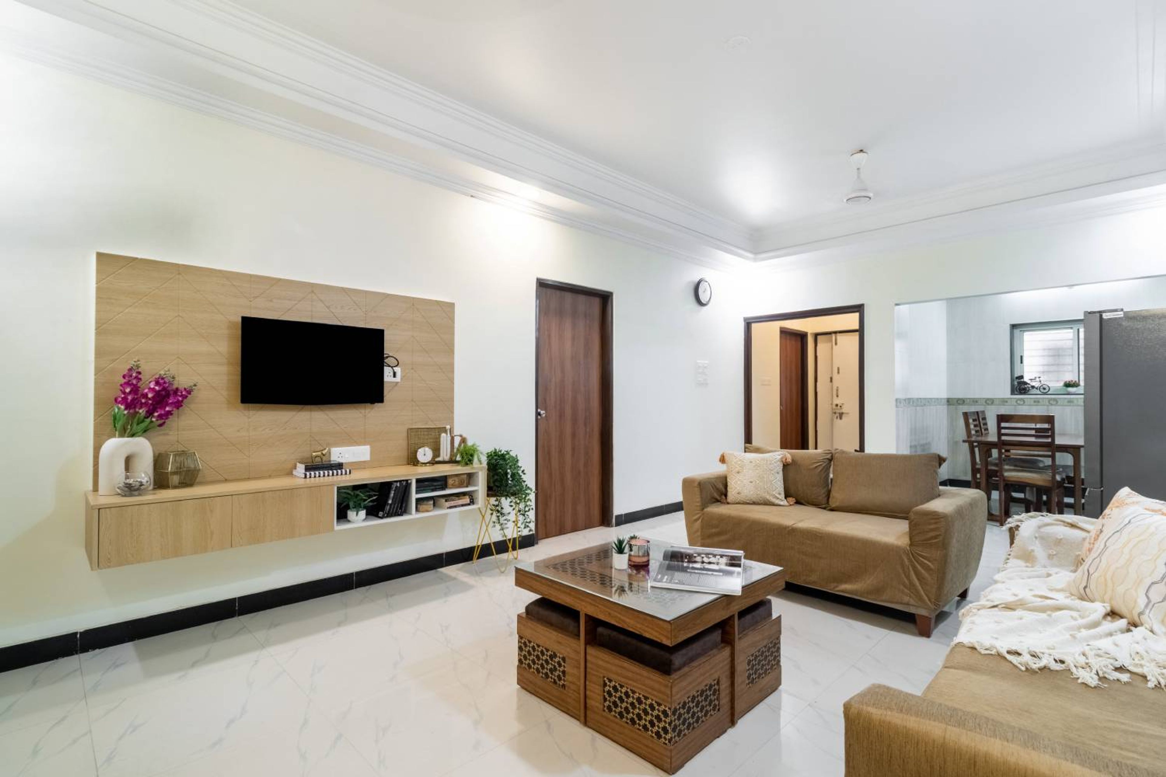 Living Room Design with Brown Sofas and TV Unit