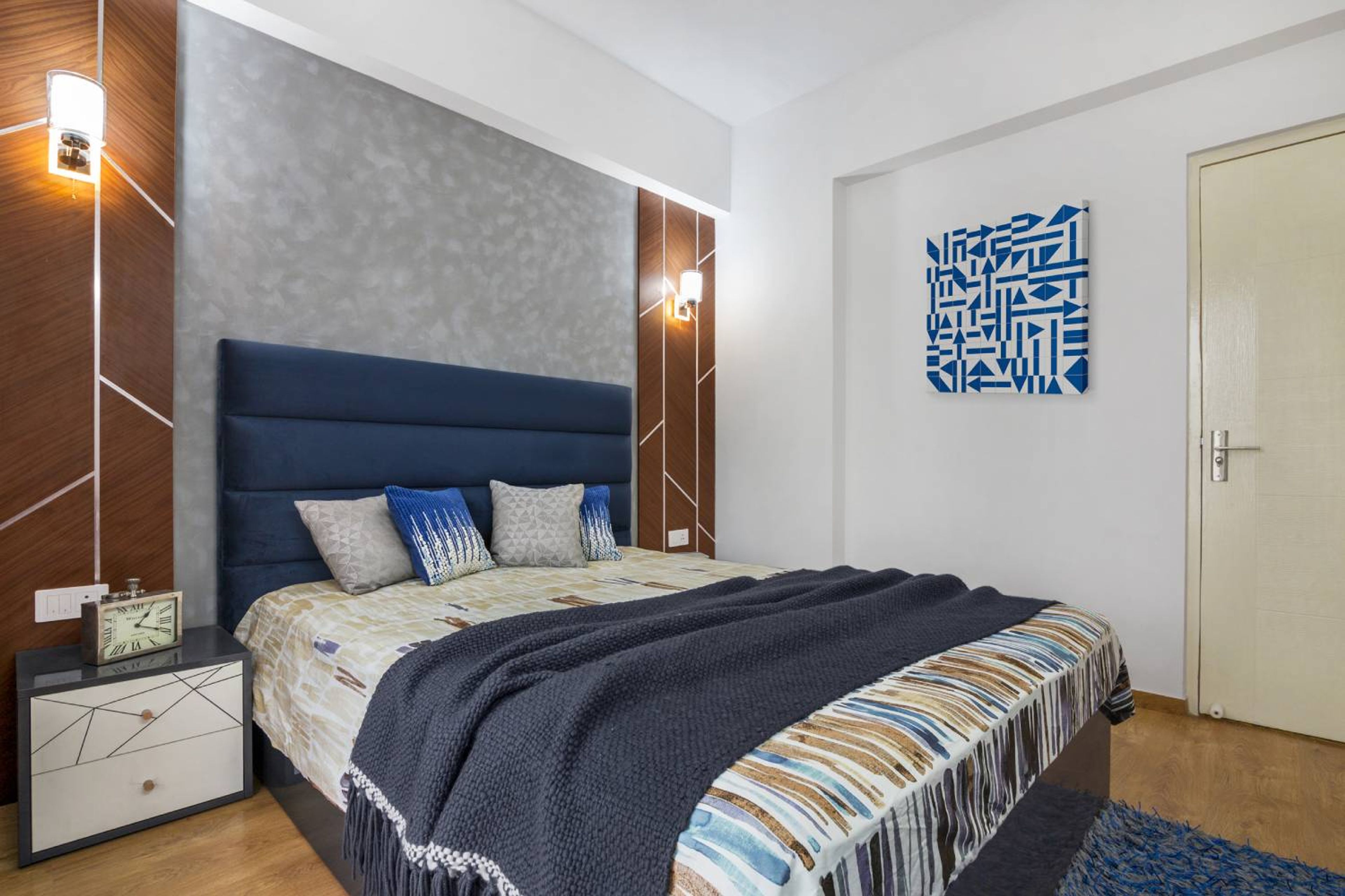 Guest Bedroom Design with Blue Tufted Headboard Bed