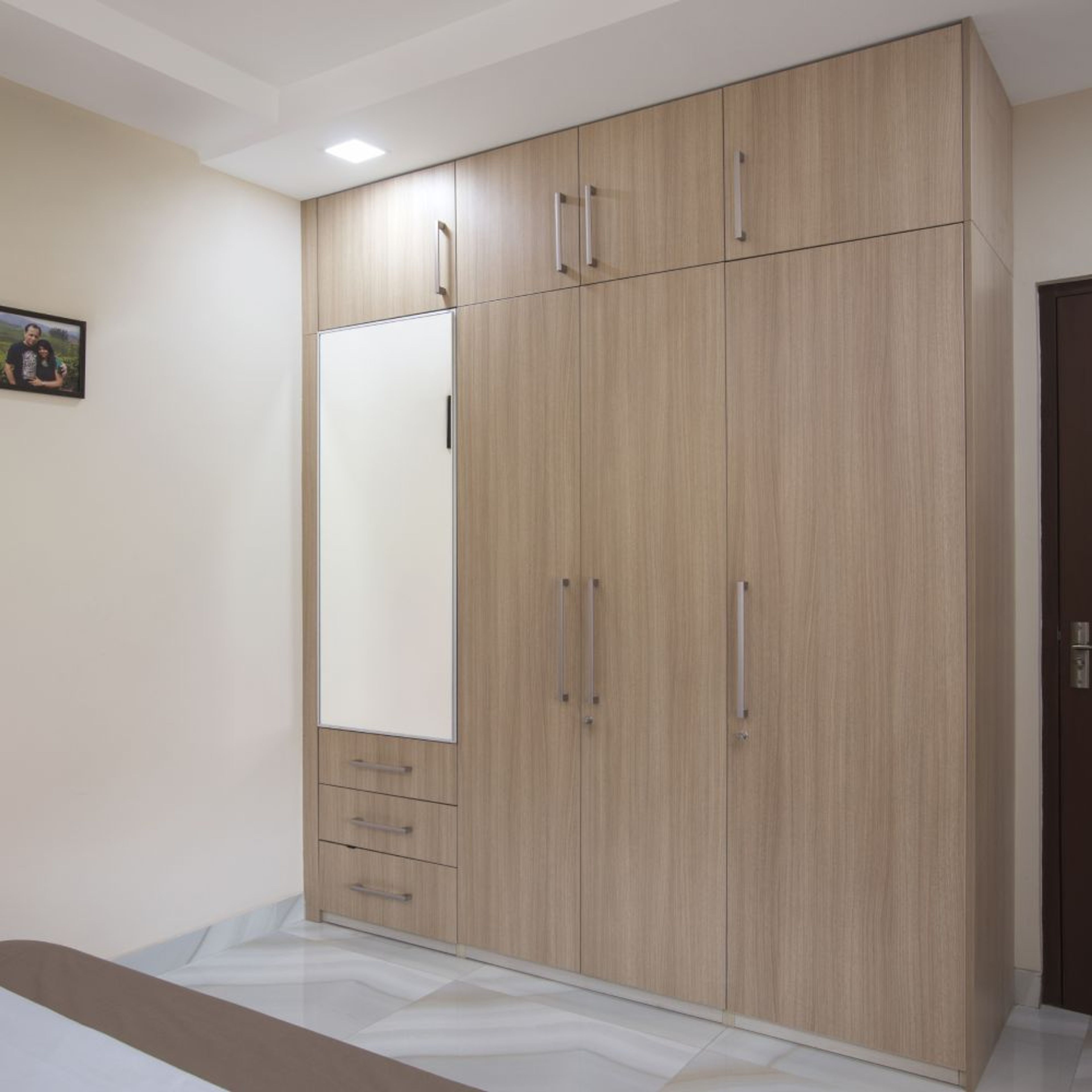Master Bedroom Design with 4-Door Swing Wardrobe