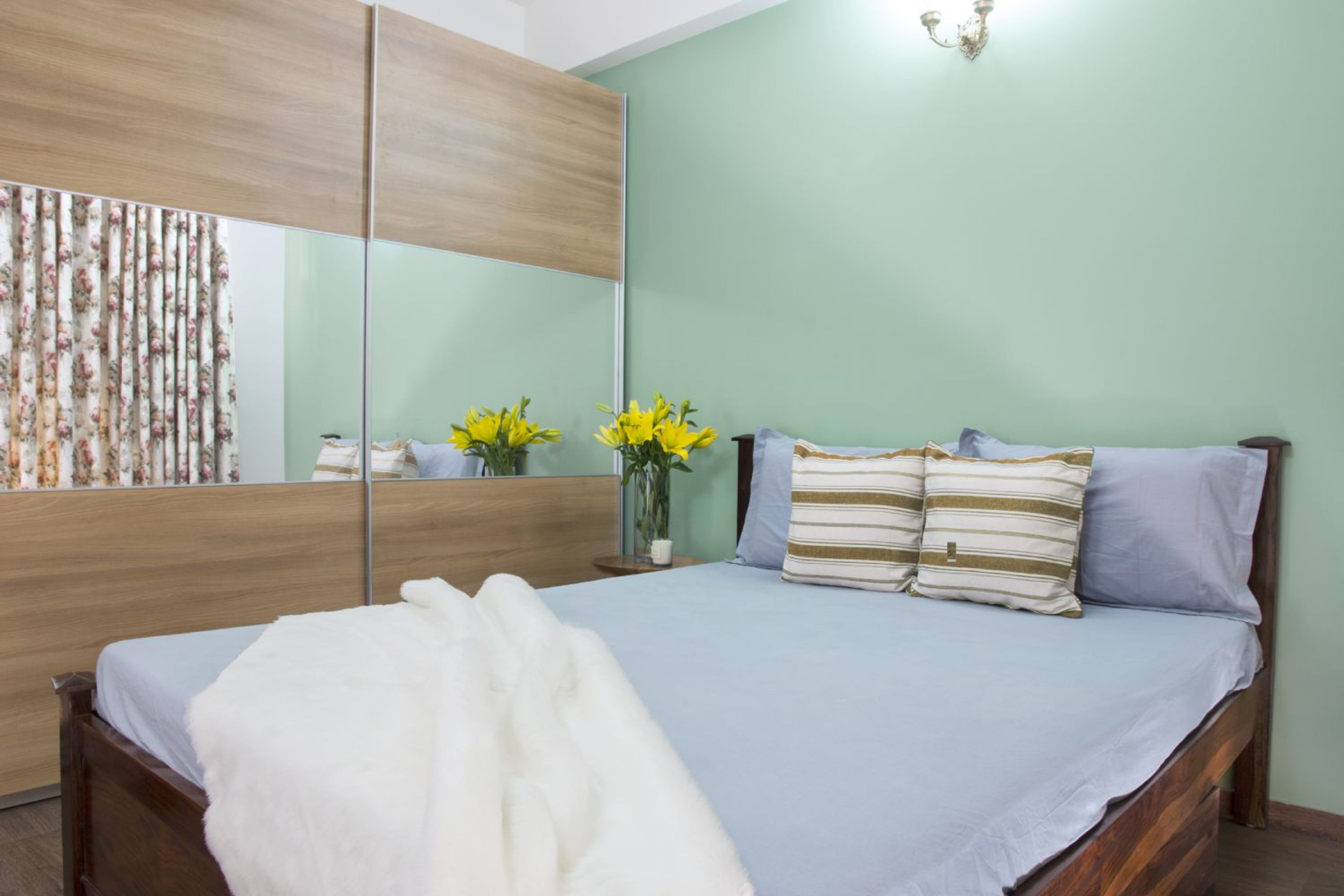 Guest Bedroom Design with Soft Green Walls