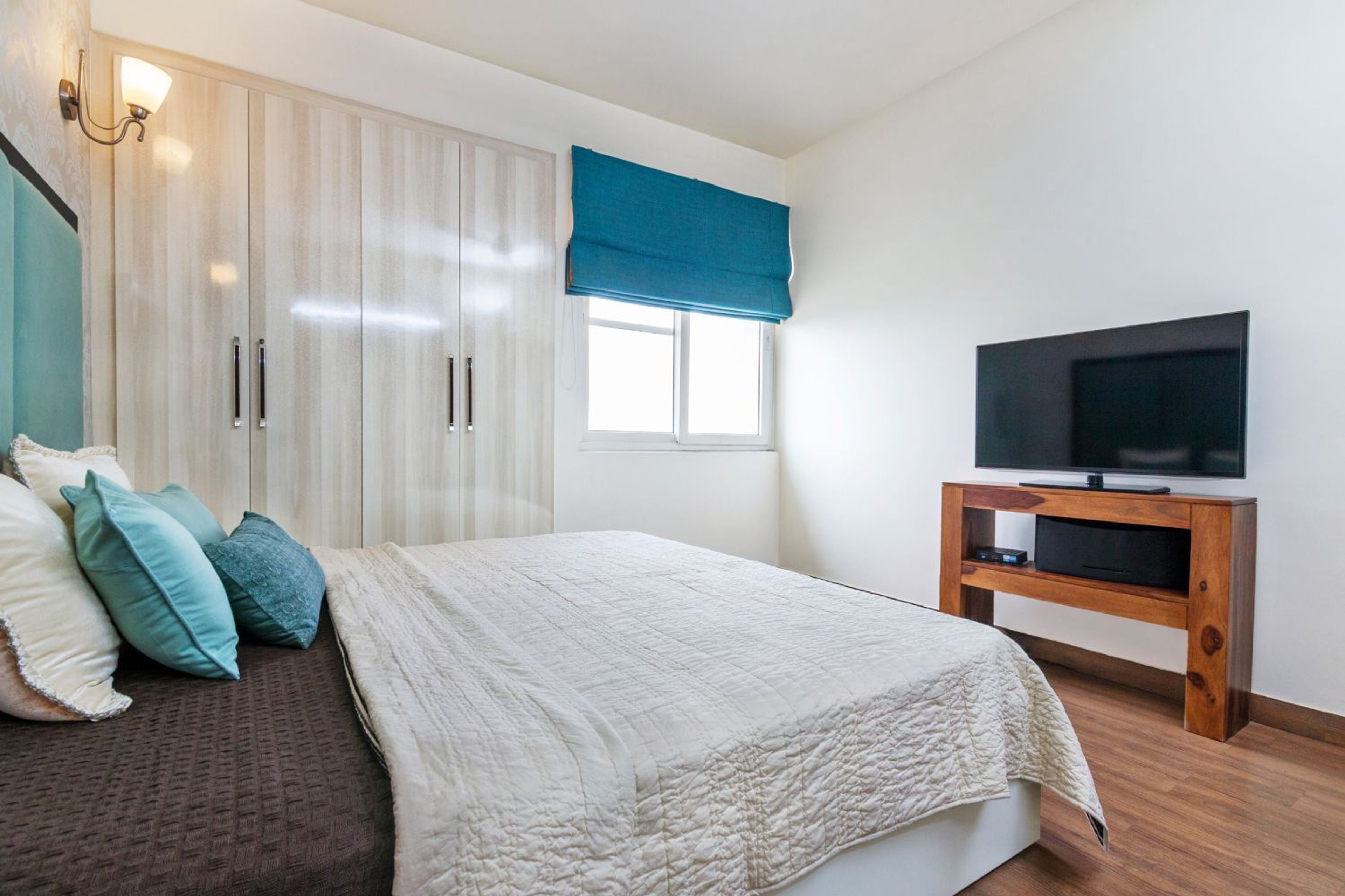 Master Bedroom Design with 4-Door Swing Wardrobe