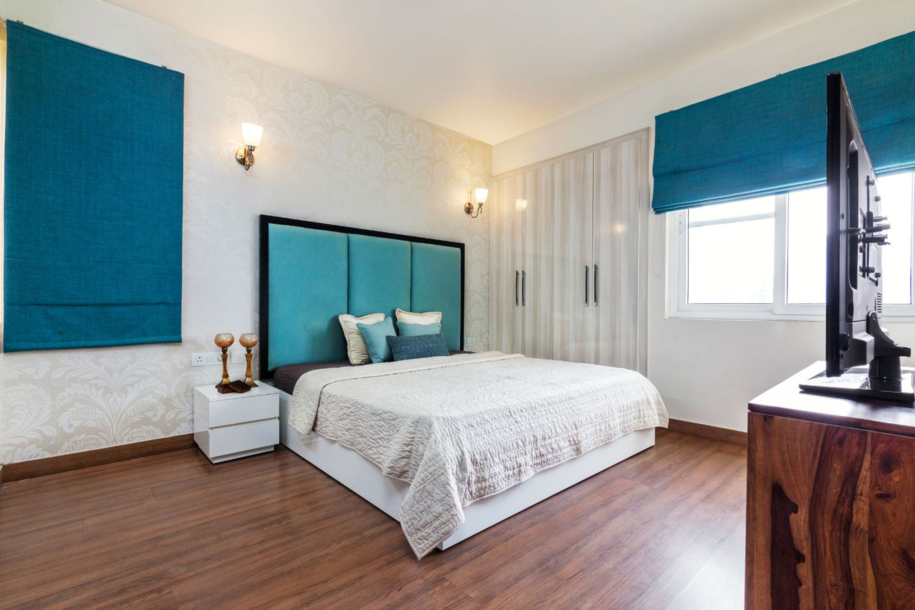 Modern 2BHK Flat Design with Blue Accents and Gold Highlights