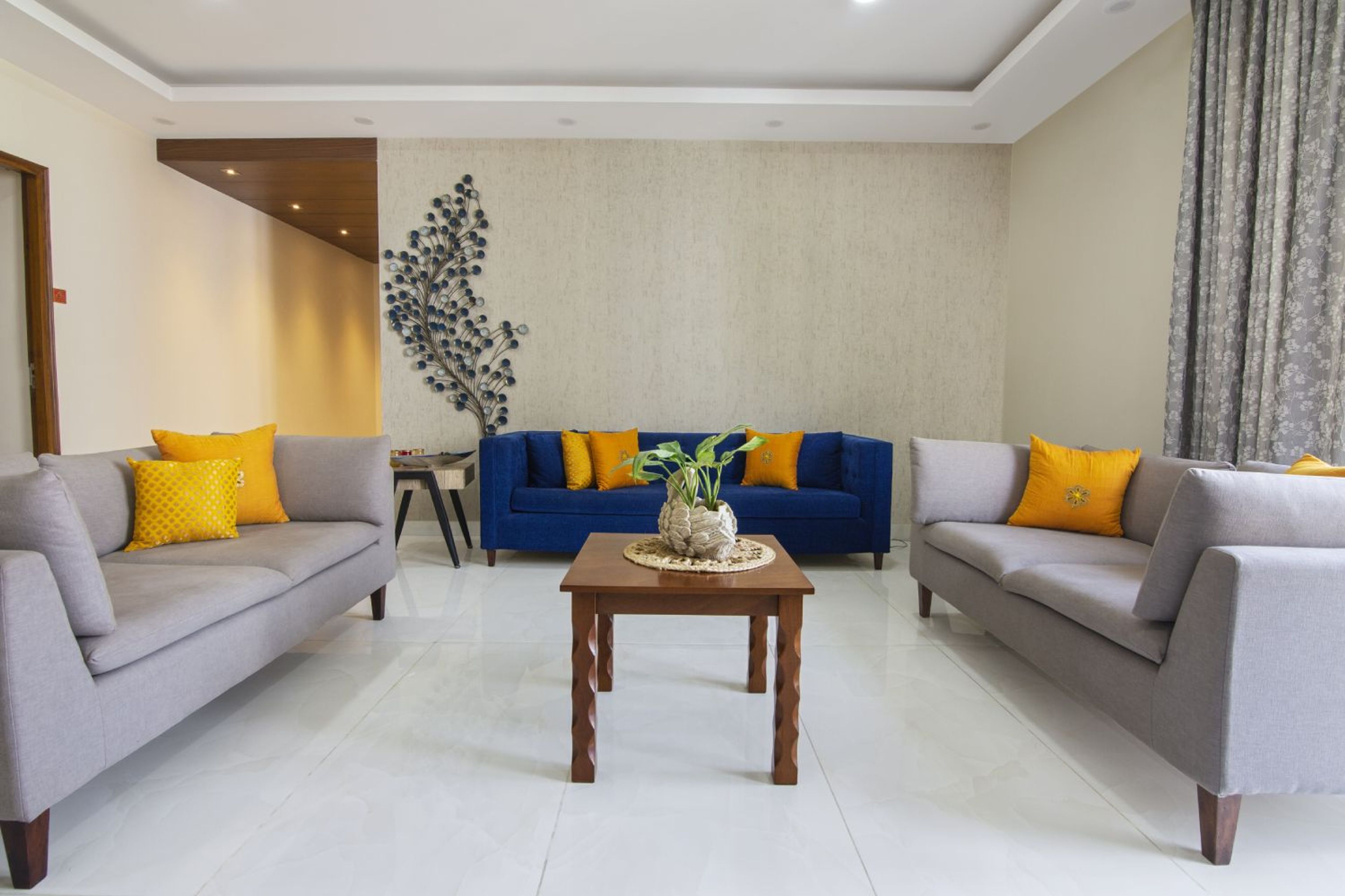 Living Room Design with Grey and Blue Sofas