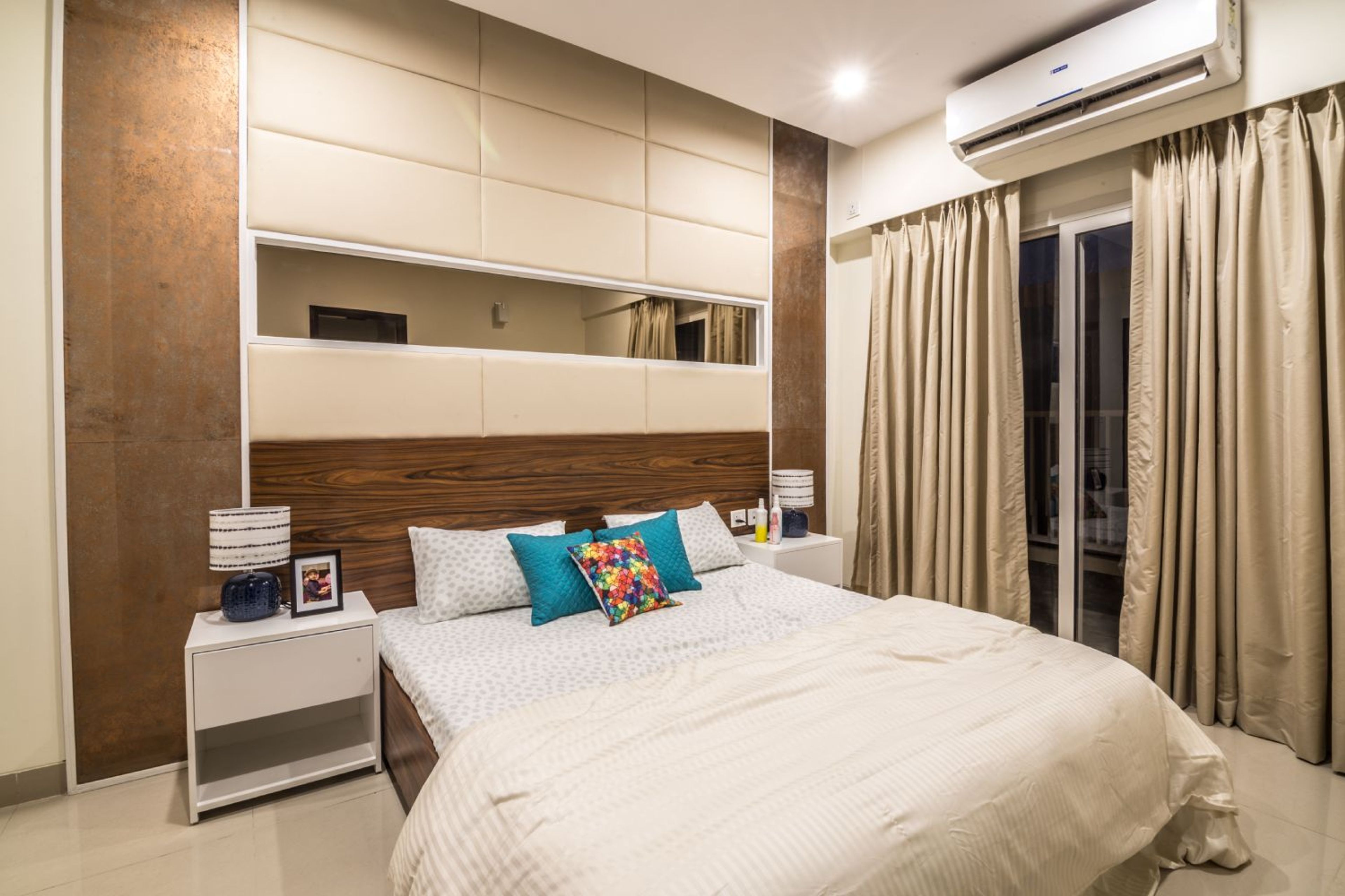 Master Bedroom Design with Cushioned and Mirror Walls