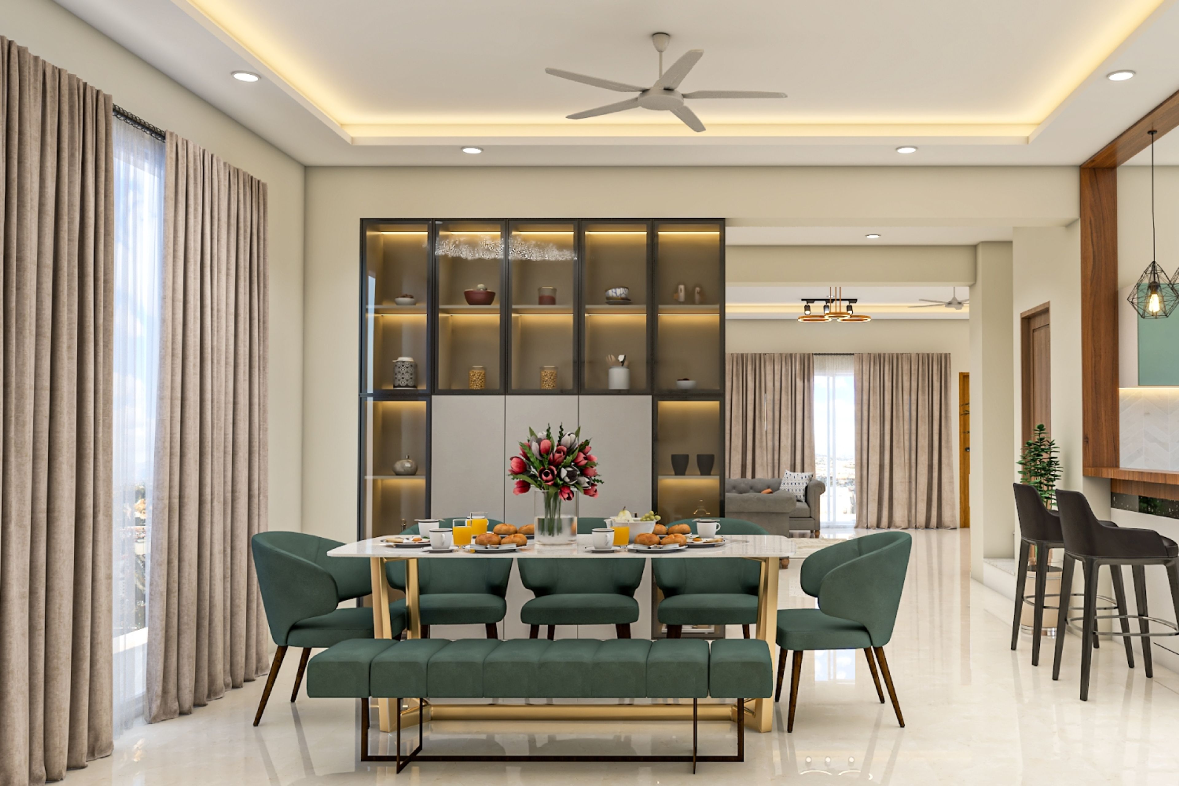 Chic dining room with green and gold 4-seater table and tall crockery unit. Ideal for small families. - Livspace