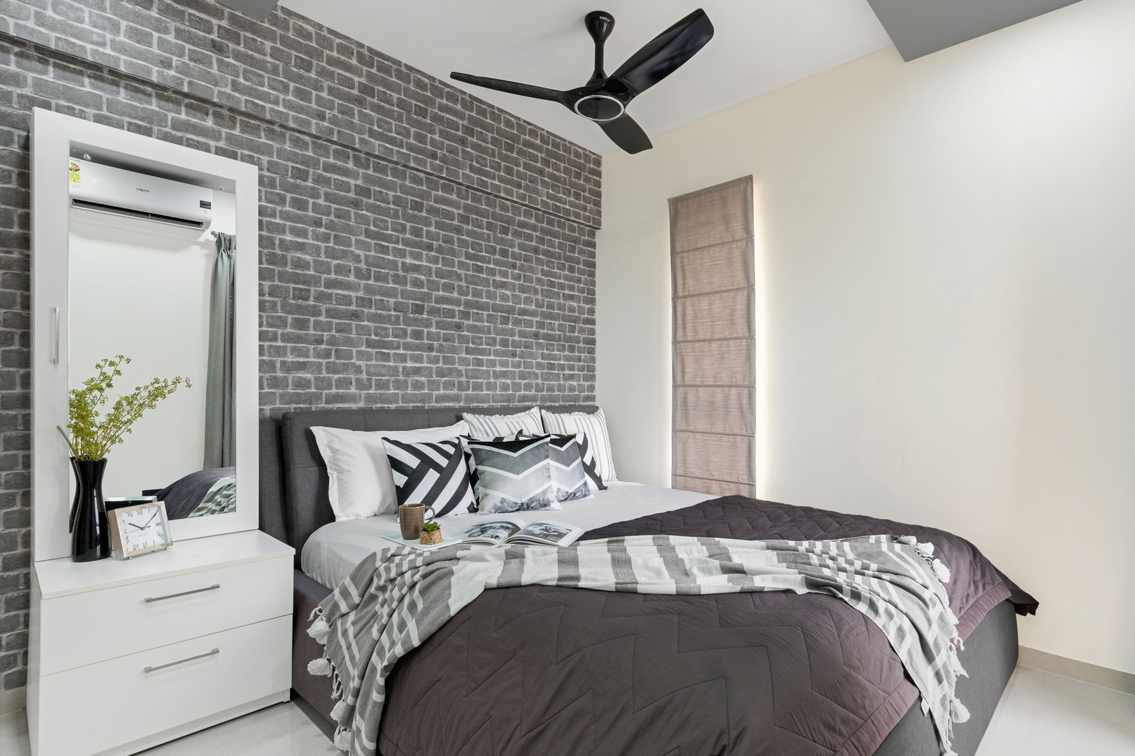 Charming Rustic Guest Room Design With Queen Bed, Grey Brick Wall, White Side Tables, and Sliding Wardrobe - Livspace
