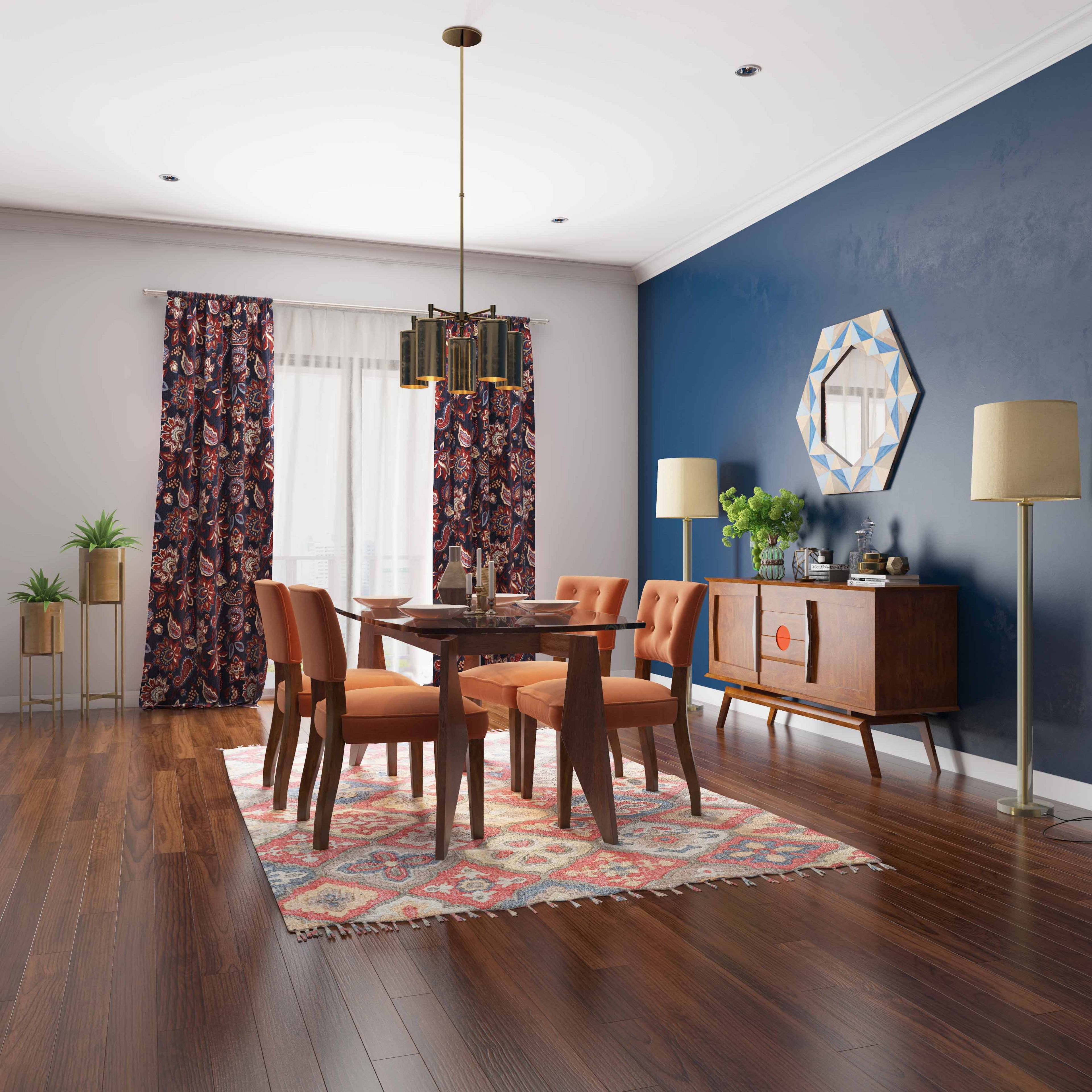 Mediterranean-inspired dining room with wood and orange 4-seater table, enhanced by dark blue accent wall and wooden storage unit. Perfect for small families. - Livspace