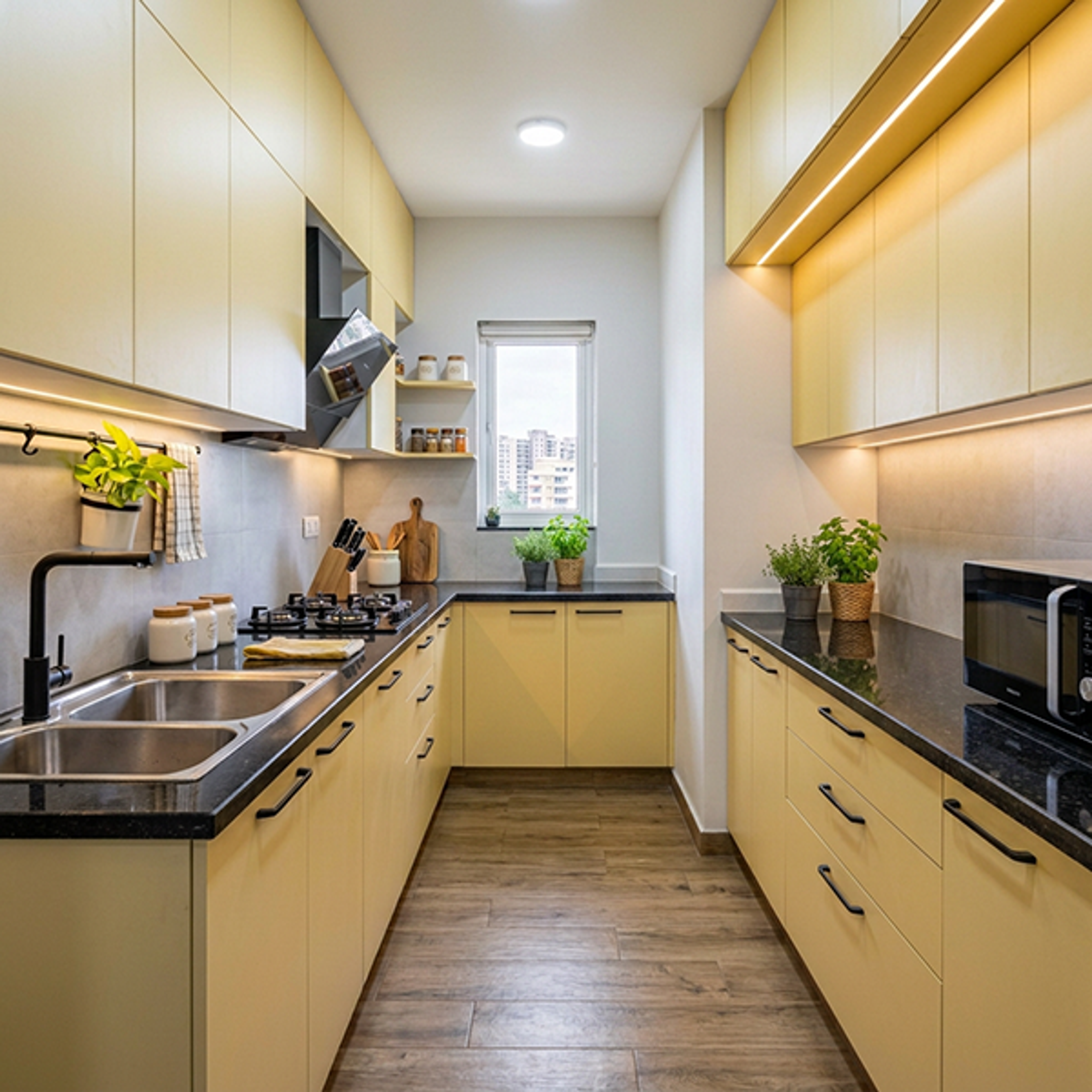 Modern Parallel Kitchen Design with Yellow Cabinets and Black Granite