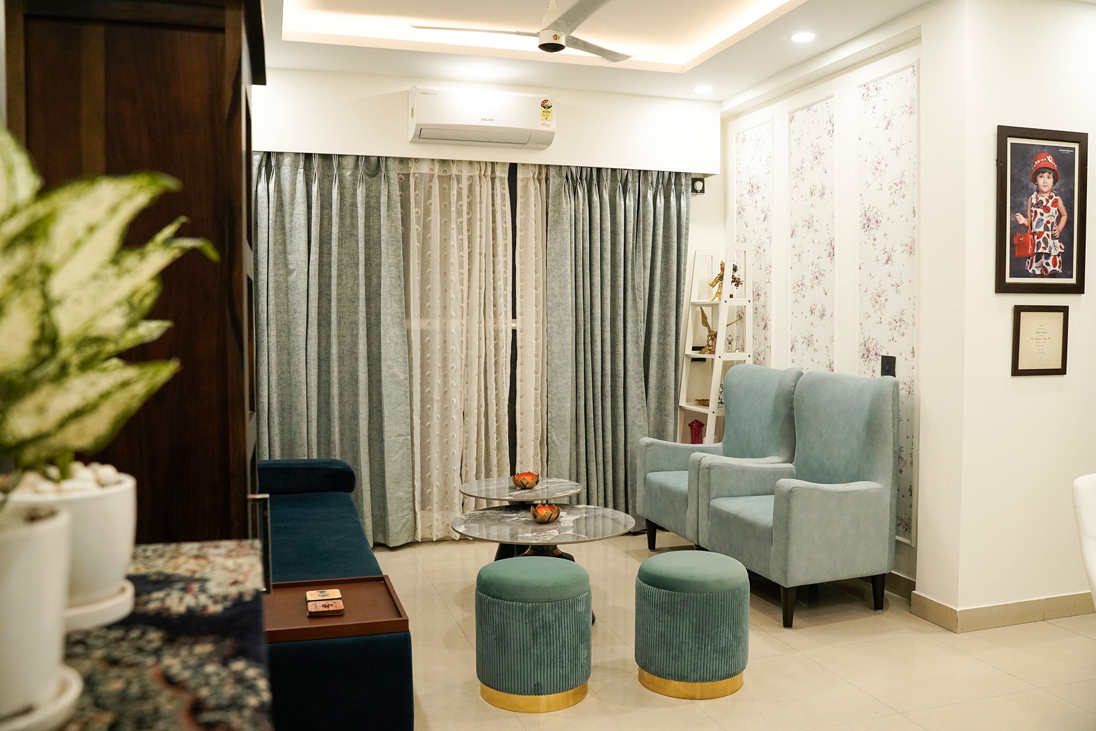 Contemporary Living Room Design with Teal Sofa and Marble Tables