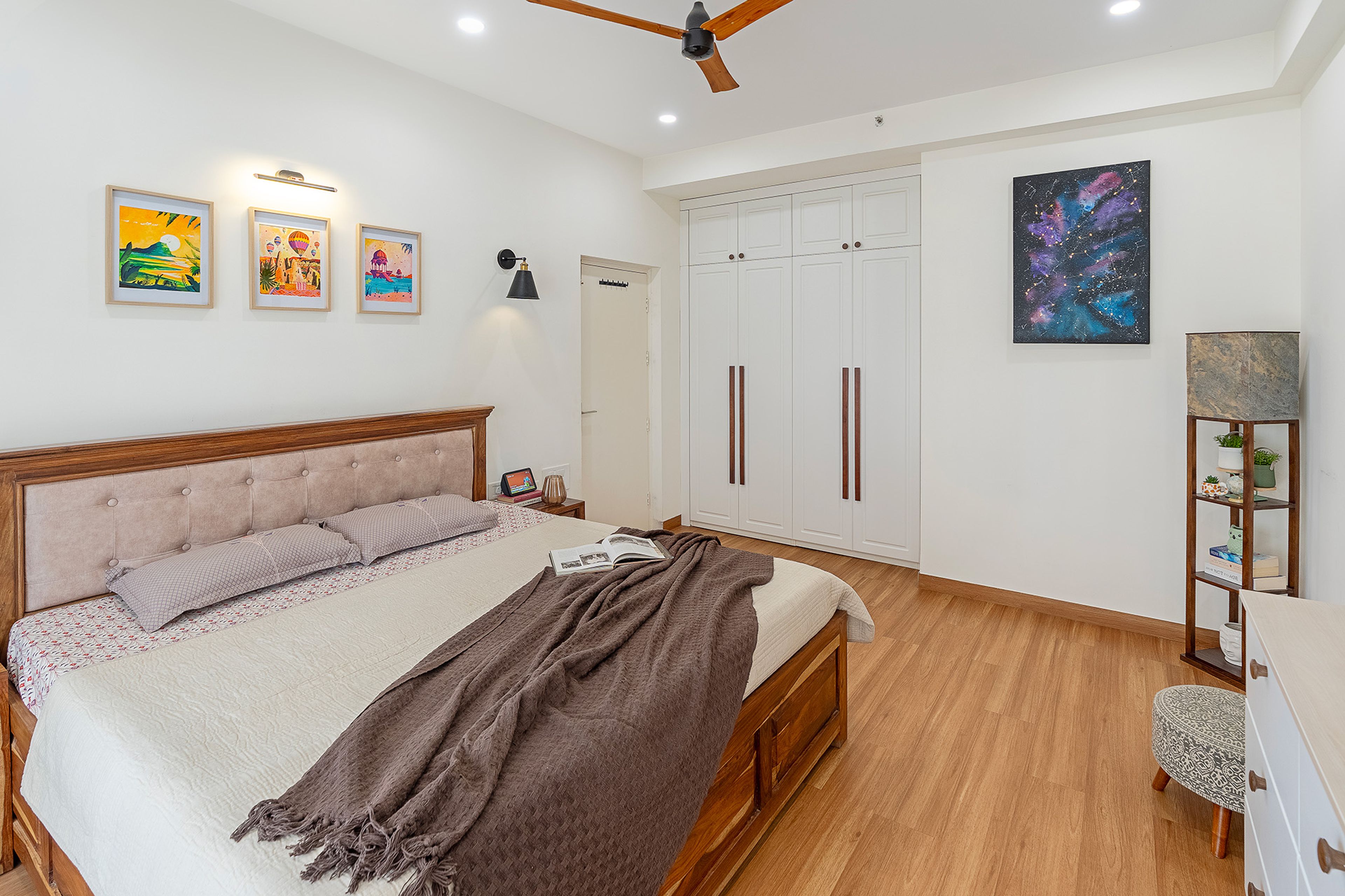 Contemporary Master Bedroom Design with Tufted Headboard Wall and Wooden Furniture