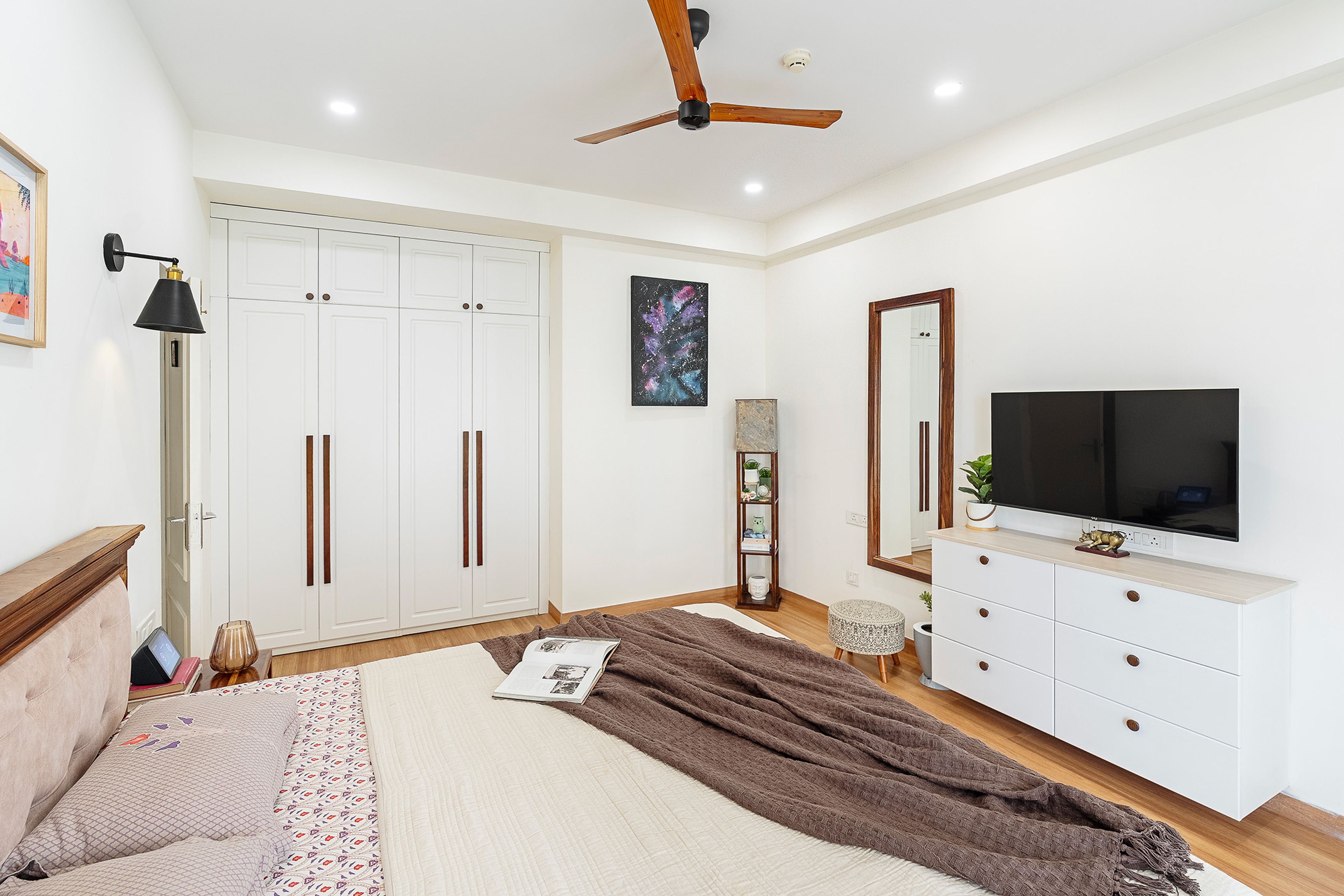 Contemporary Master Bedroom Design with Tufted Headboard Wall and Wooden Furniture