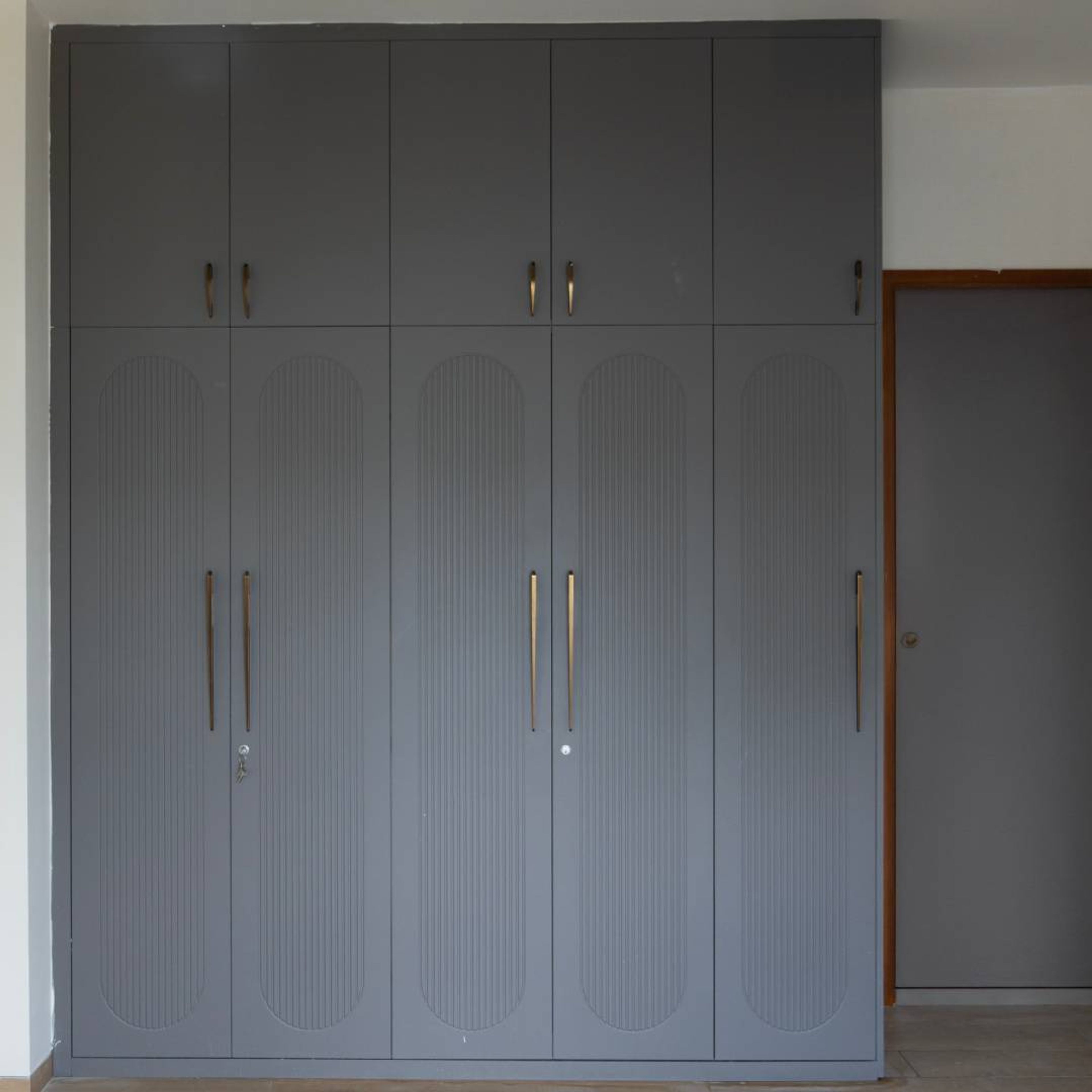Grey Classic Sliding Wardrobe Design with Textured Rounded Panel Doors
