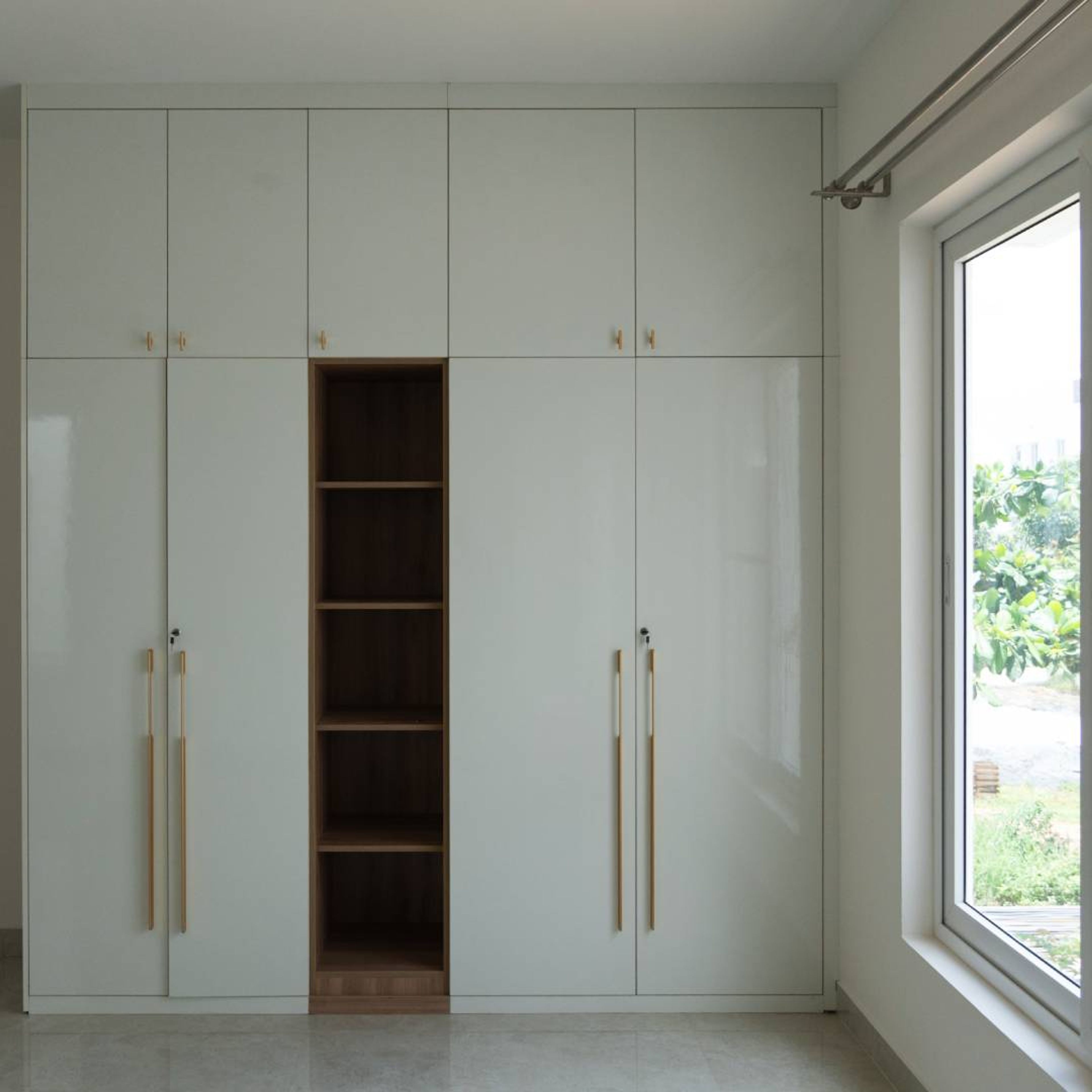 White and Walnut Modern Swing Wardrobe Design with Central Open Display Niche
