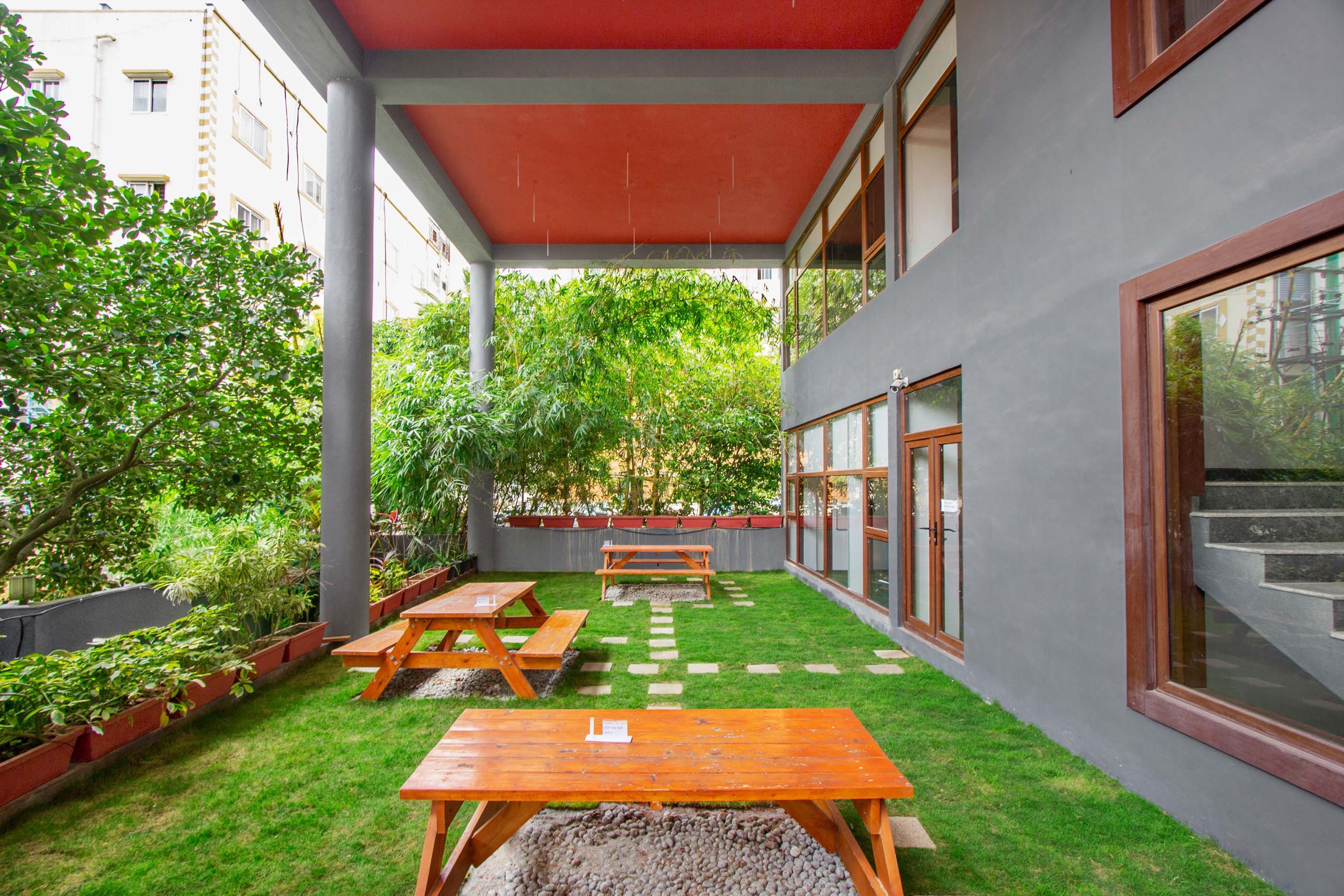 Contemporary Balcony Design with Grey Accent Wall and Spacious Seating Area