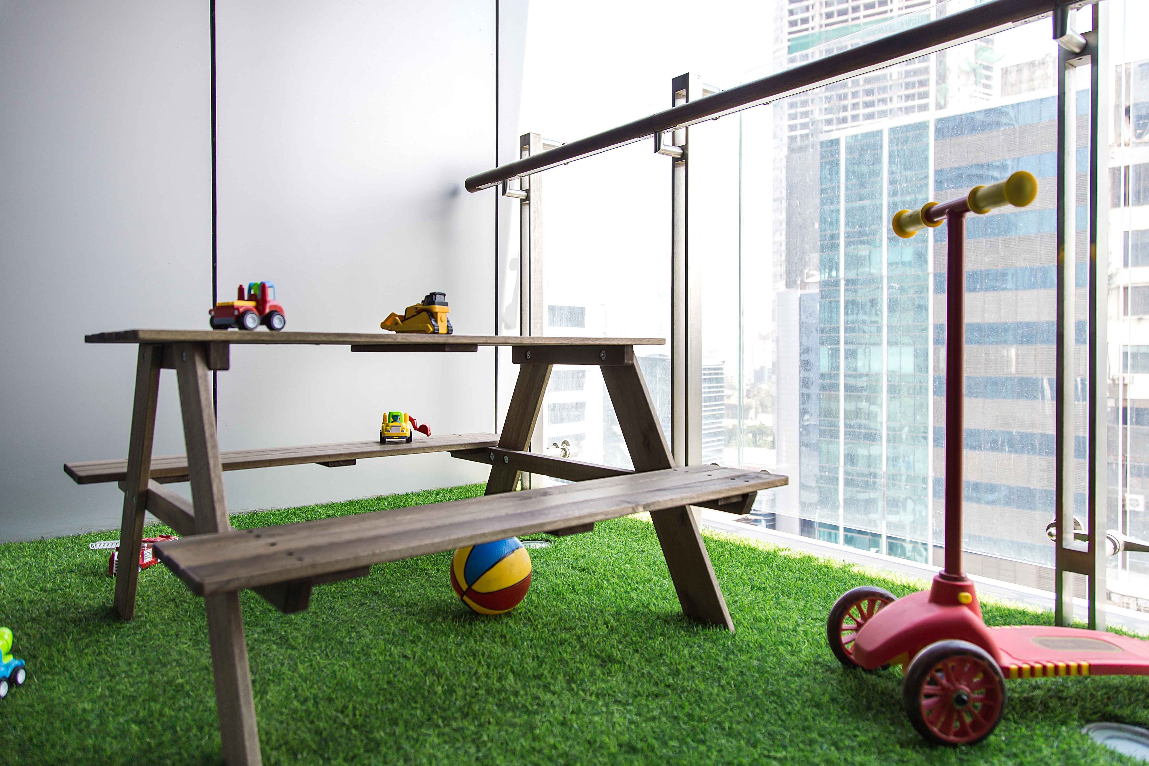 Contemporary Balcony Design with White Paneled Walls and Wooden Bench