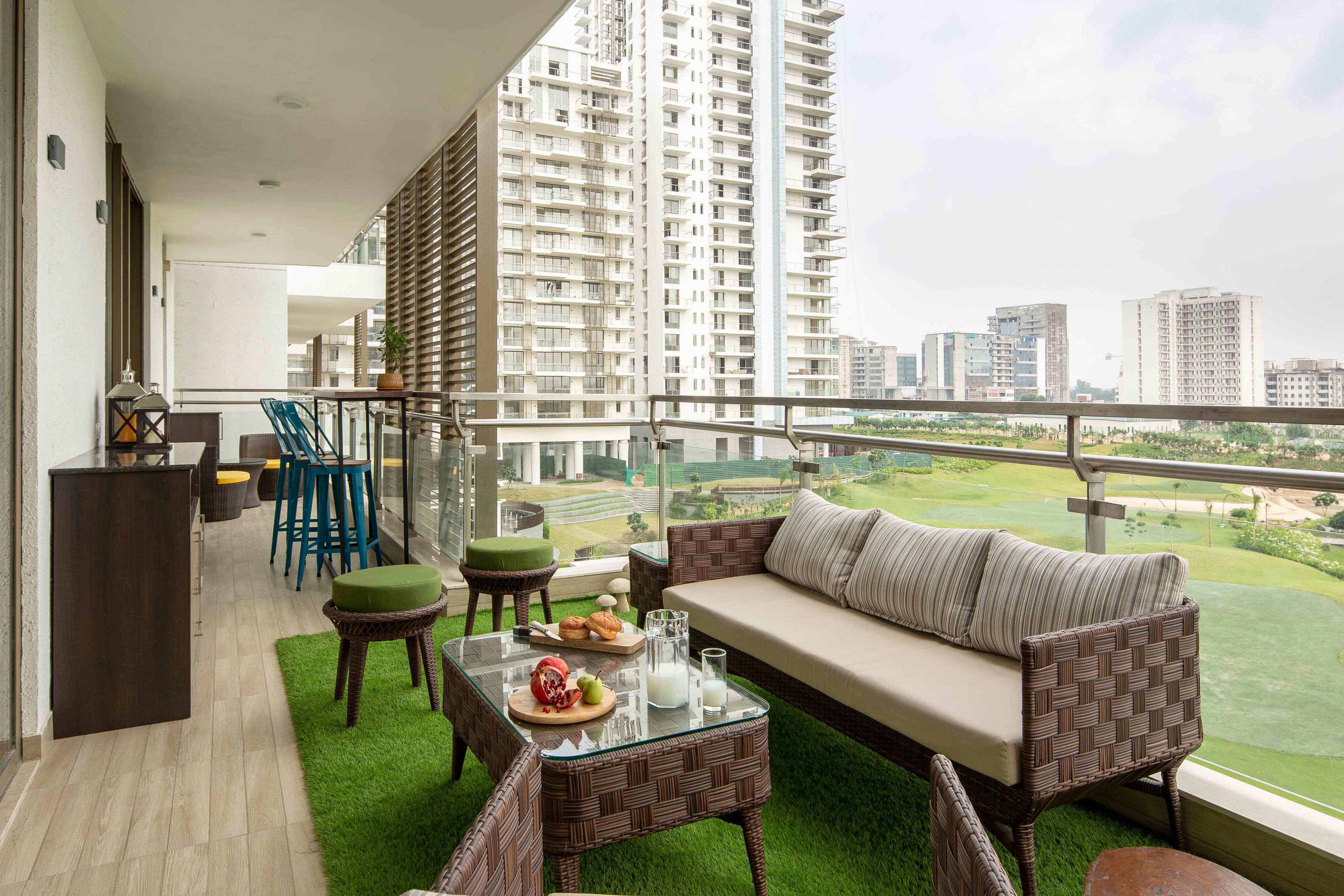 Contemporary Balcony Design with Solid Off-White Wall and Stylish Furnishings