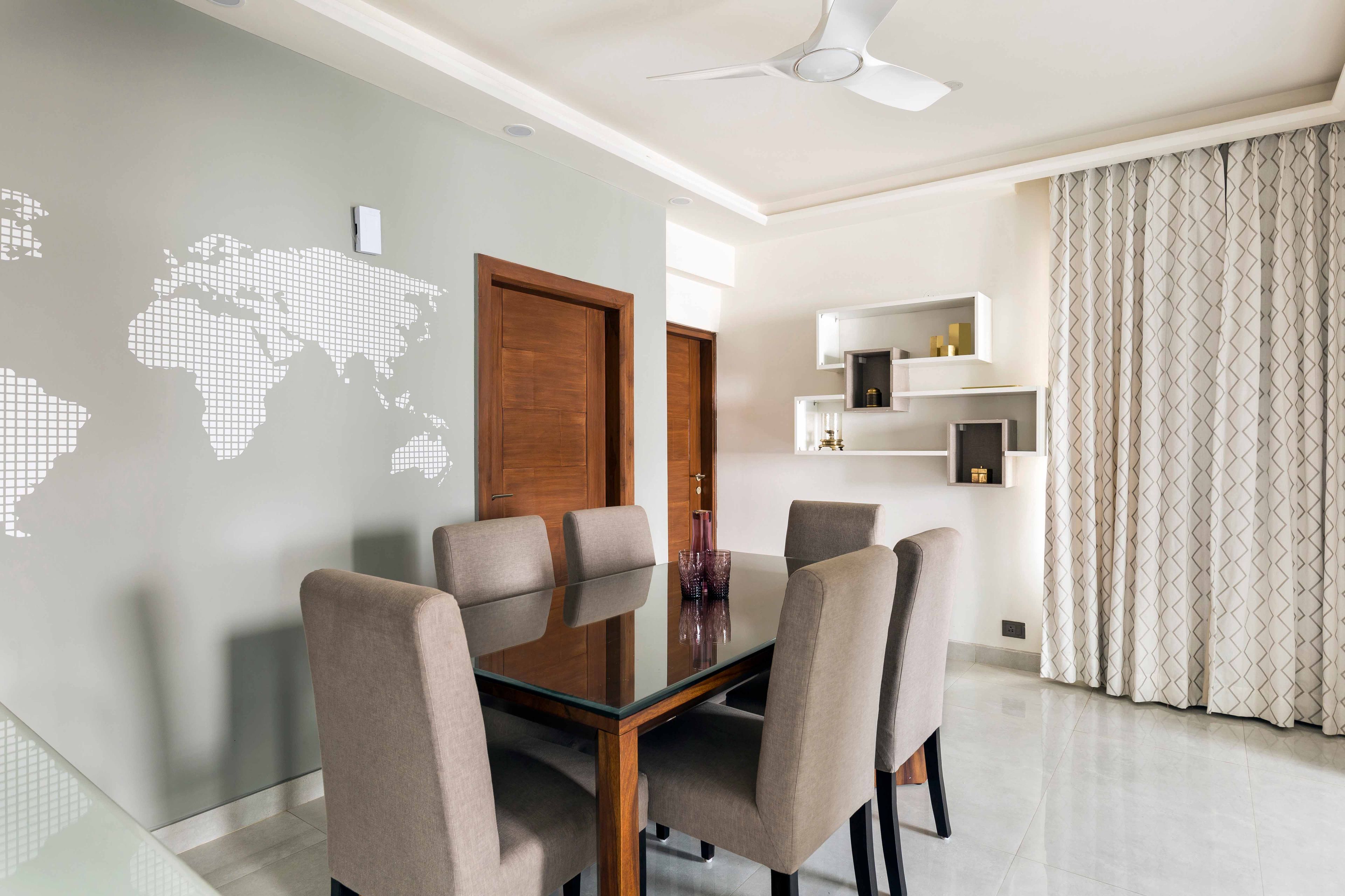 7x10 Ft Beige And Wood Dining Room Design With Grey Accent Wall And World Map - Livspace