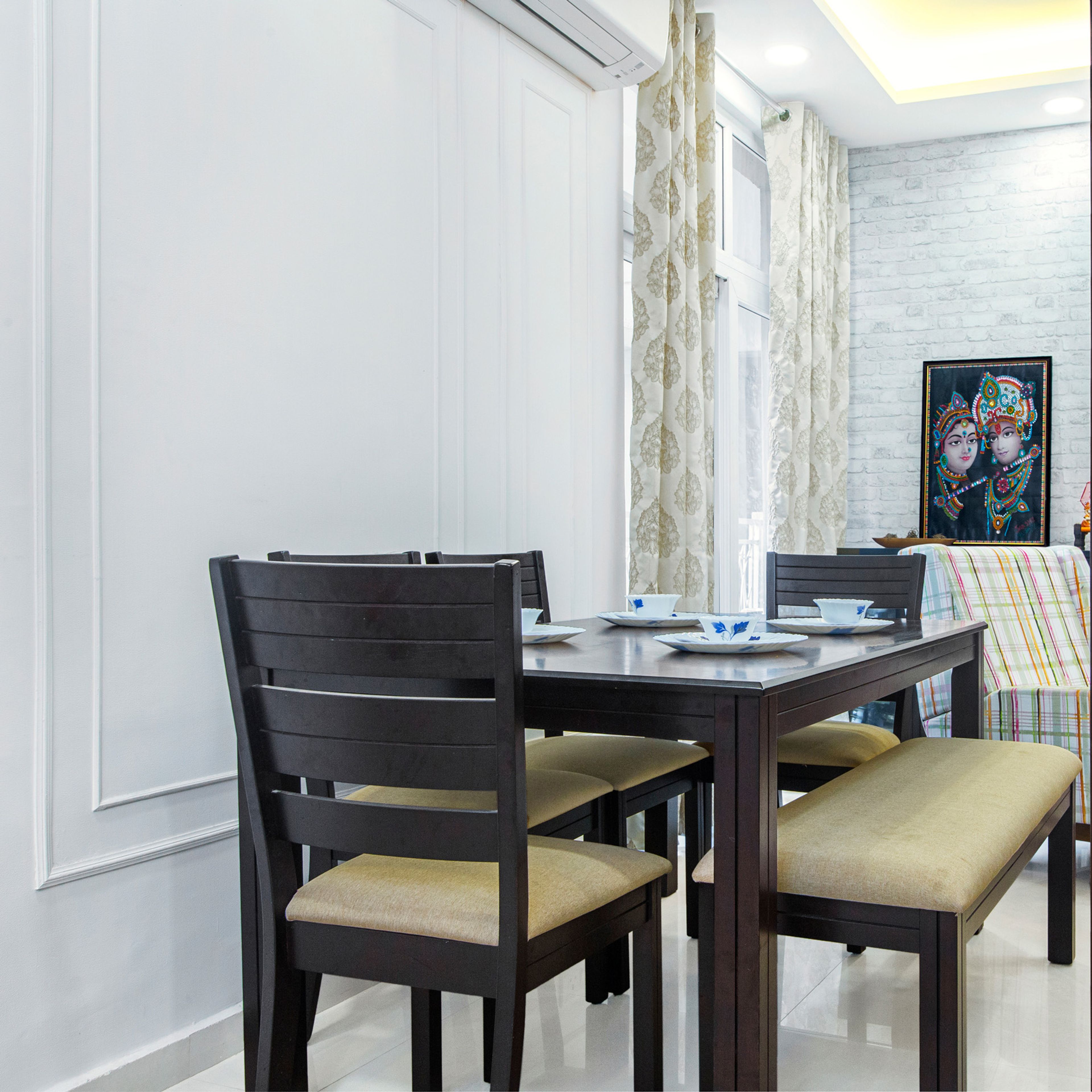 6x7 Ft 4-Seater Dning Room Design With Beige Cushions And A Seater - Livspace