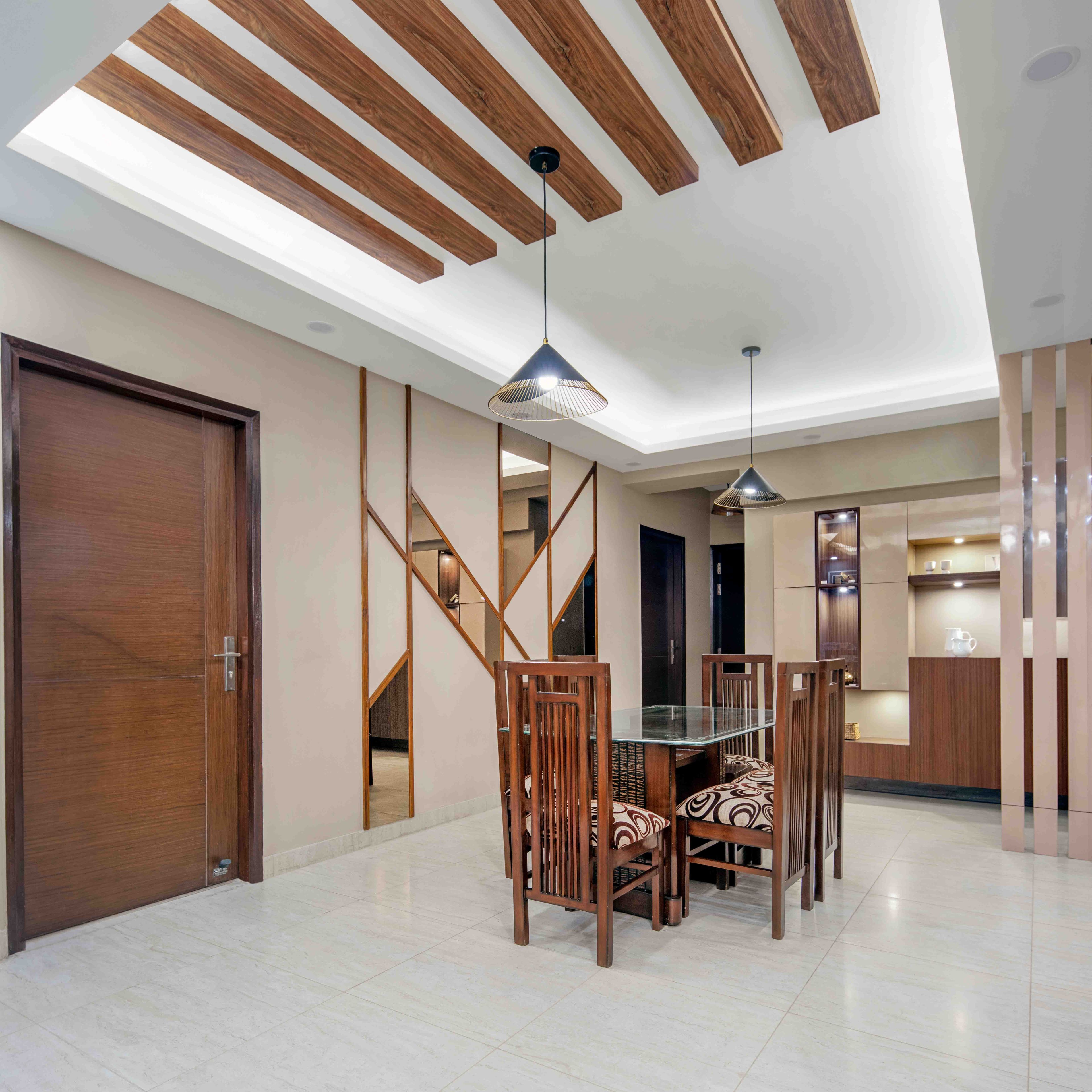9x12 6-Seater Wooden Dining Room Design With Patterned High Chairs And Wooden False Ceiling - Livspace