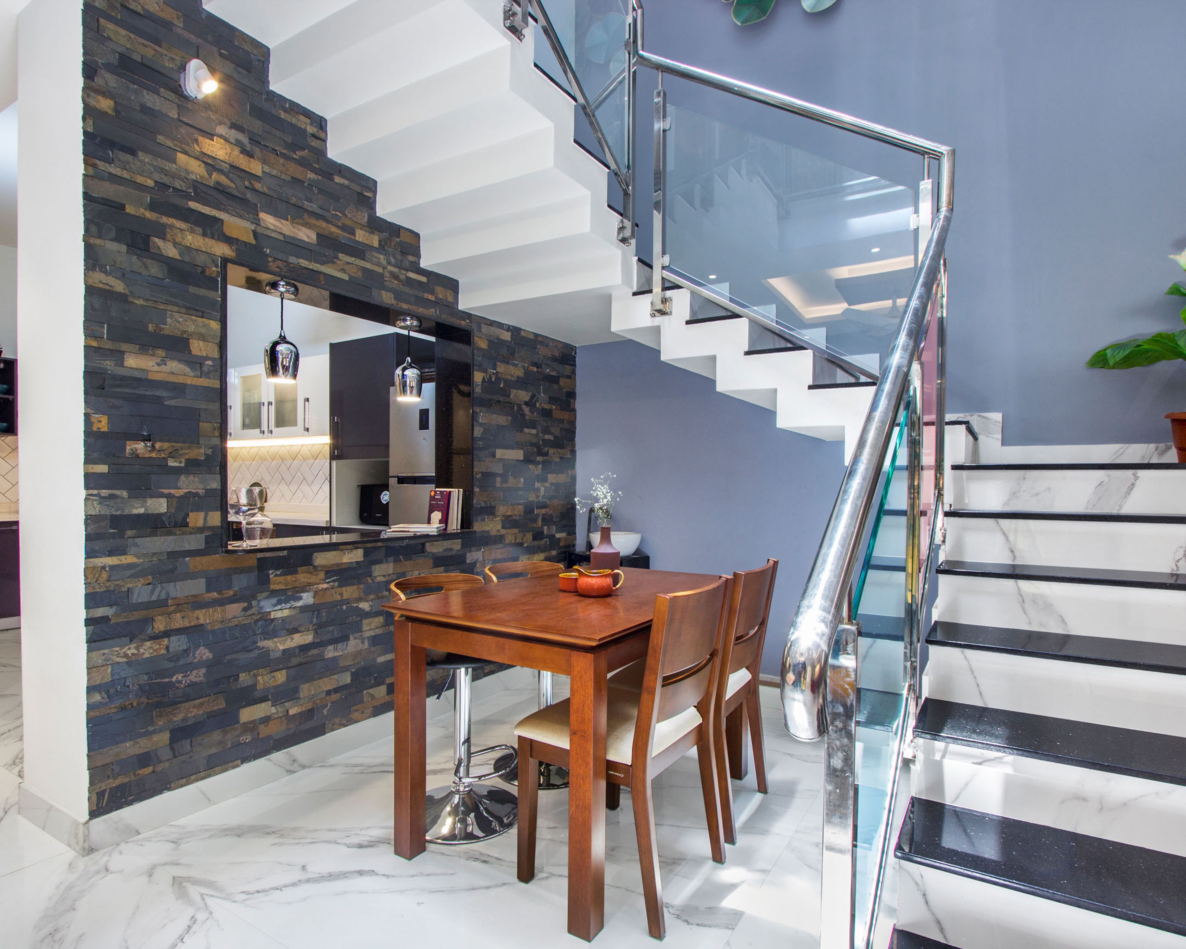 Contemporary 4-Seater Dining Room Design With Wall Cladding And Two High Bar Stools