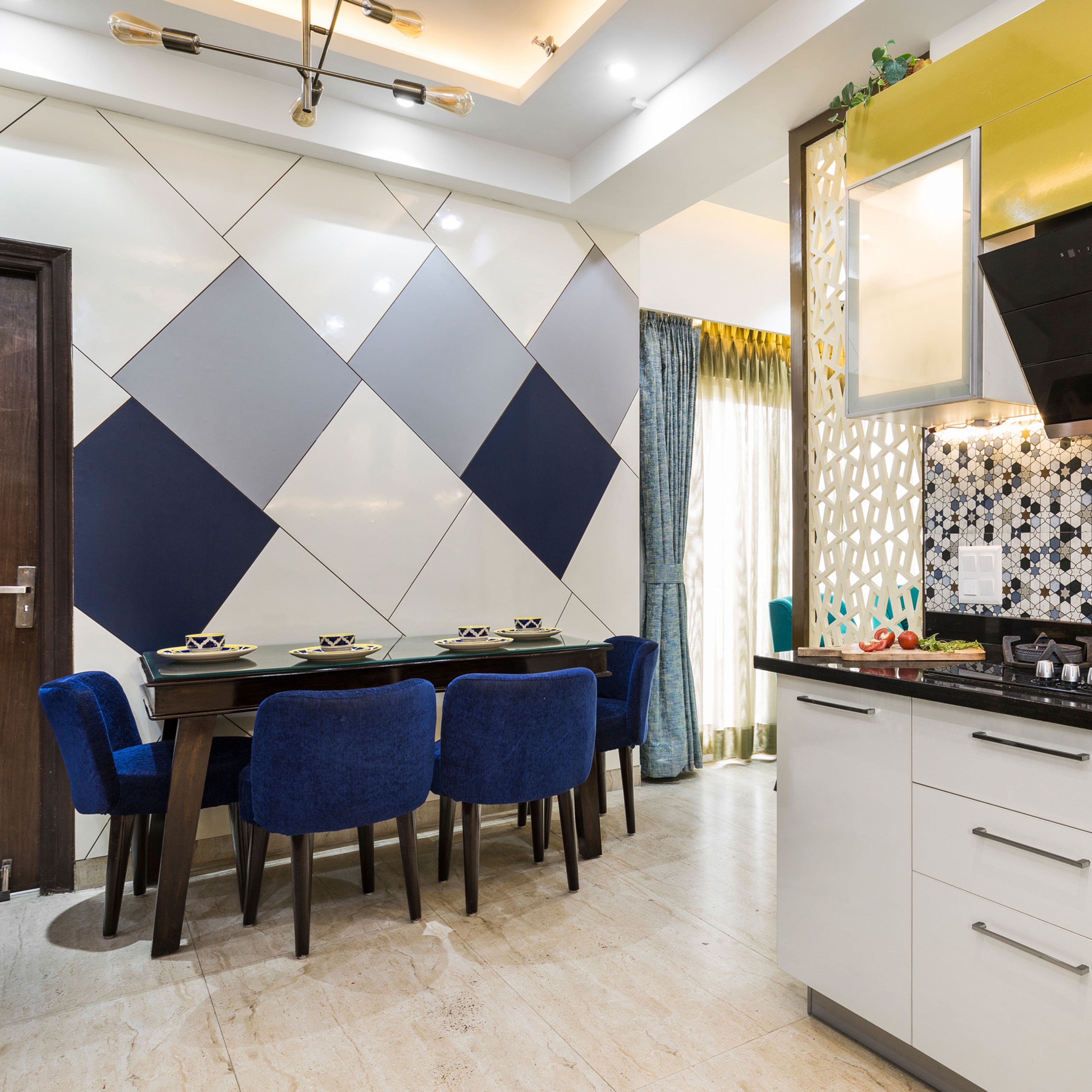 Modern 4-Seater Dining Room Design In Blue And Wood With Geometric Accent Wall