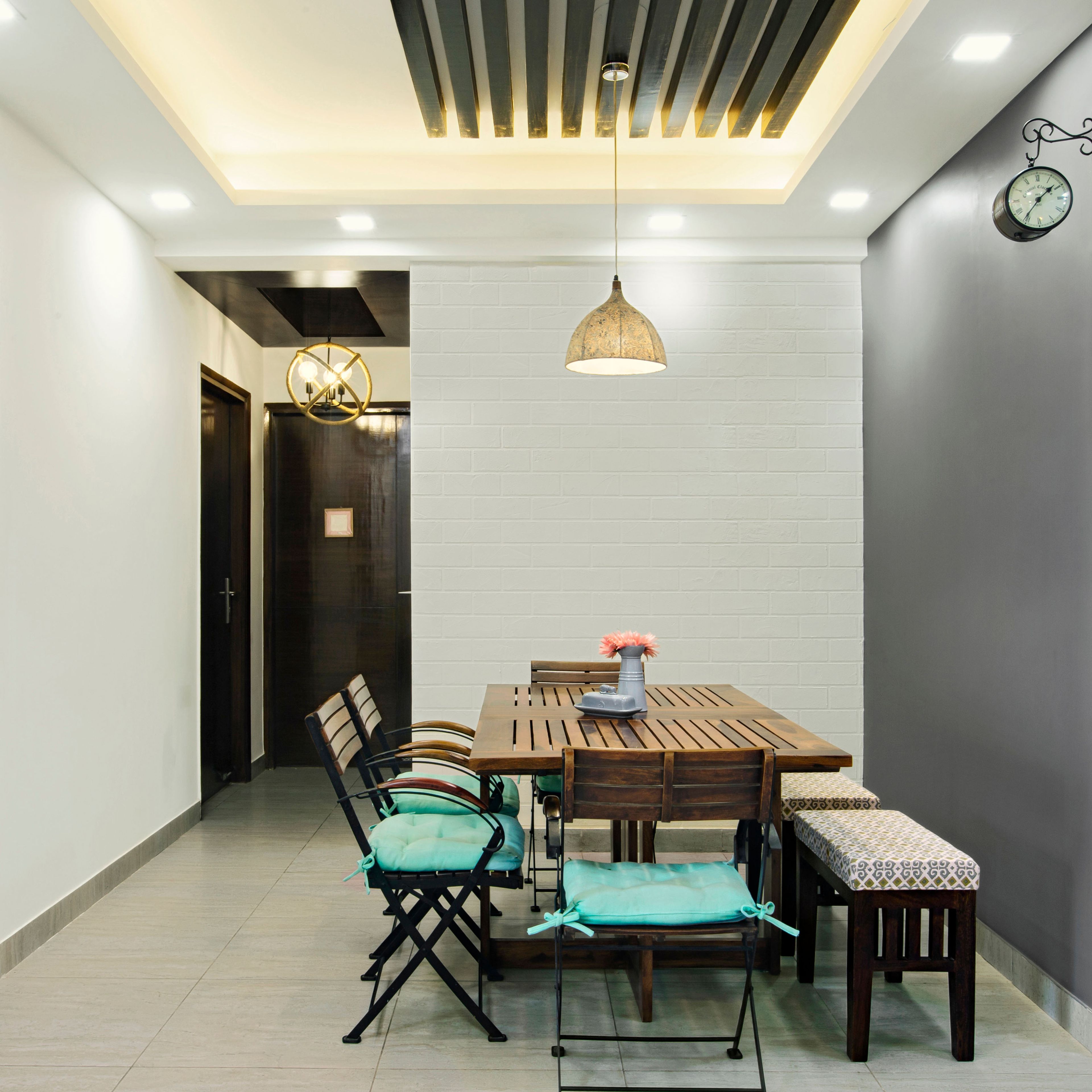 Modern Blue And Wood 4-Seater Dining Room Design With White Brick Accent Wall