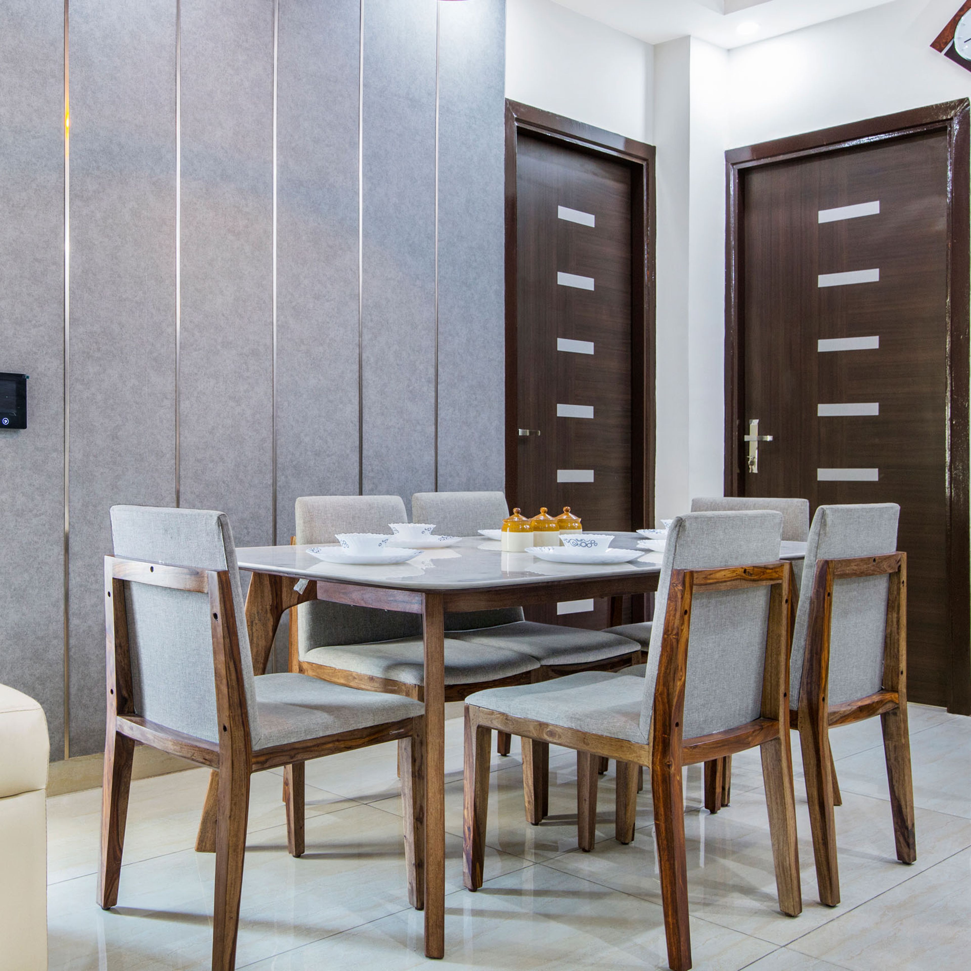 Contemporary 6-Seater Dining Room Design With Grey Accent Wall And Stripes