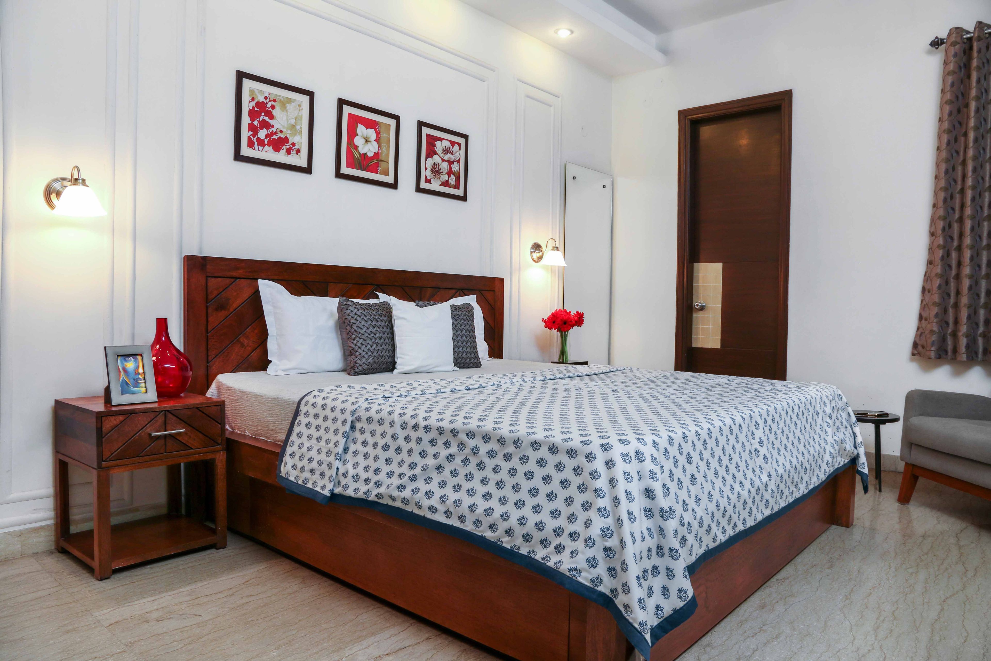 Classic Guest Room Design With White Wall Trims And Wooden Queen-Sized Bed