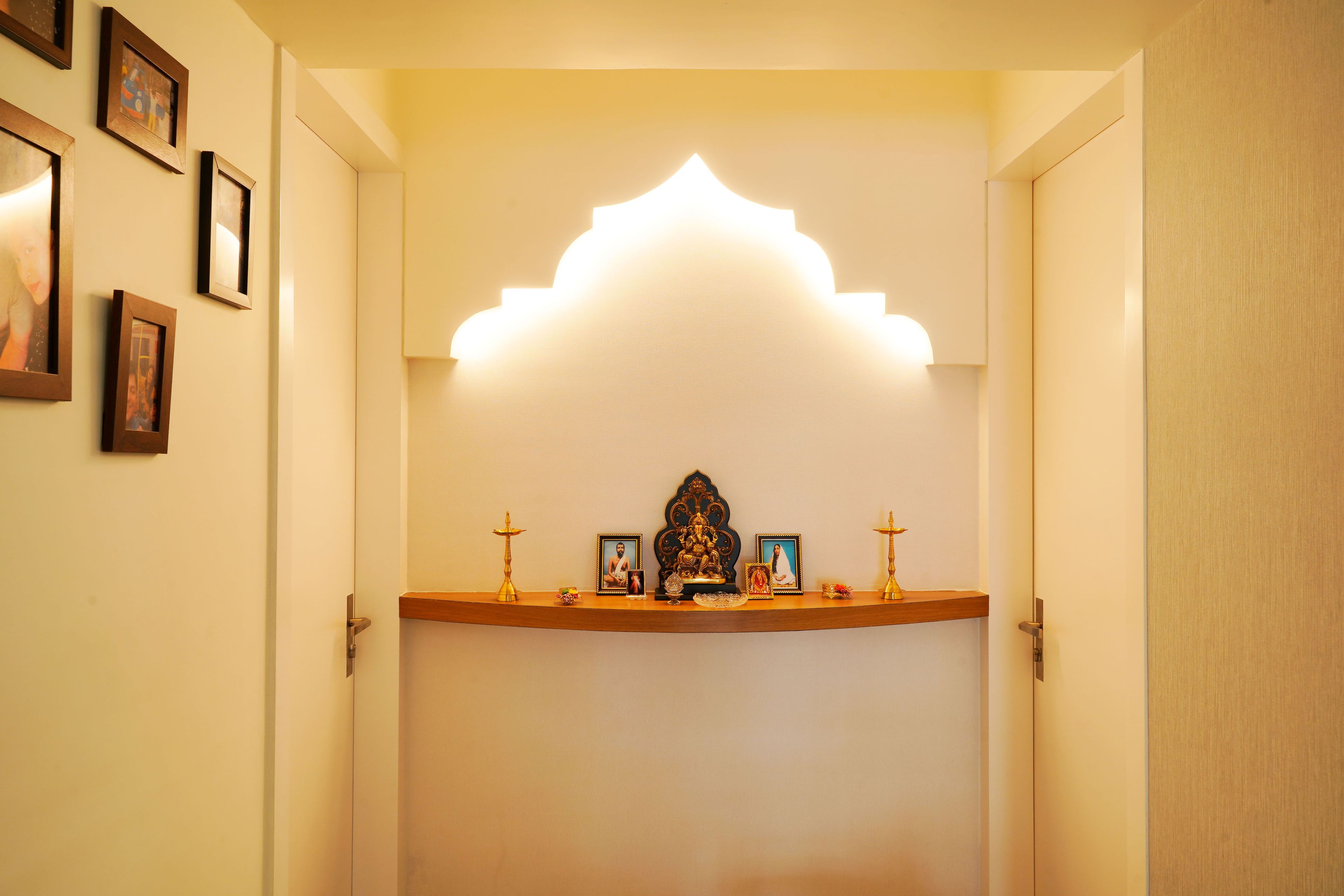 Minimalistic Pooja Room Design With Wooden Wall Ledge - Livspace