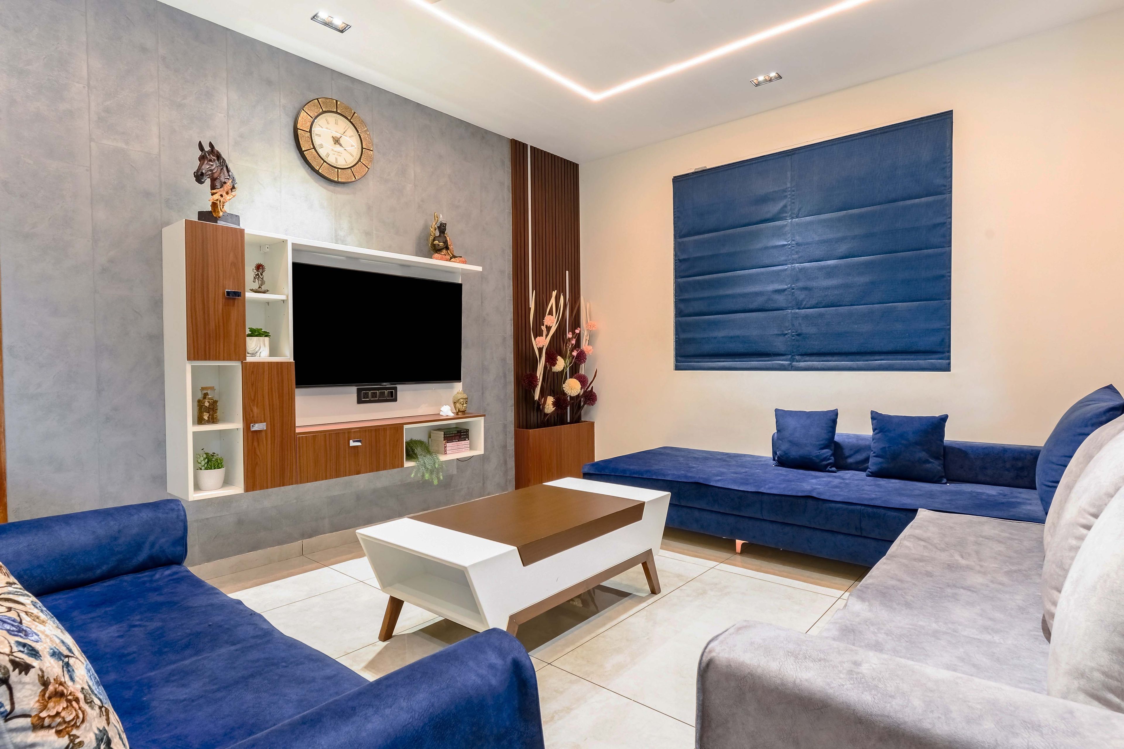 Grey And Blue Living Room Design With White And Wood TV Unit - Livspace