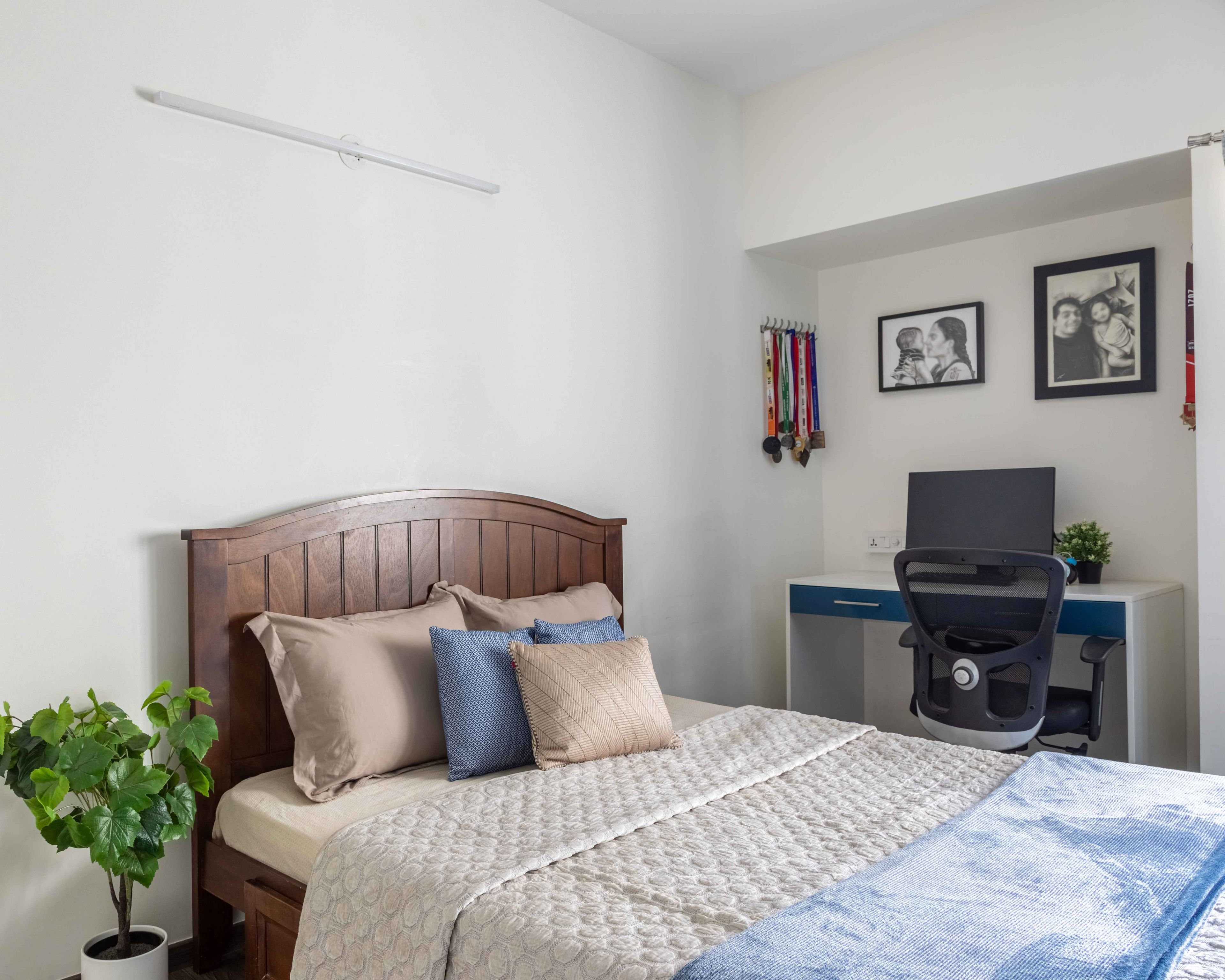 Compact Master Bedroom Design With Wooden Headboard - Livspace