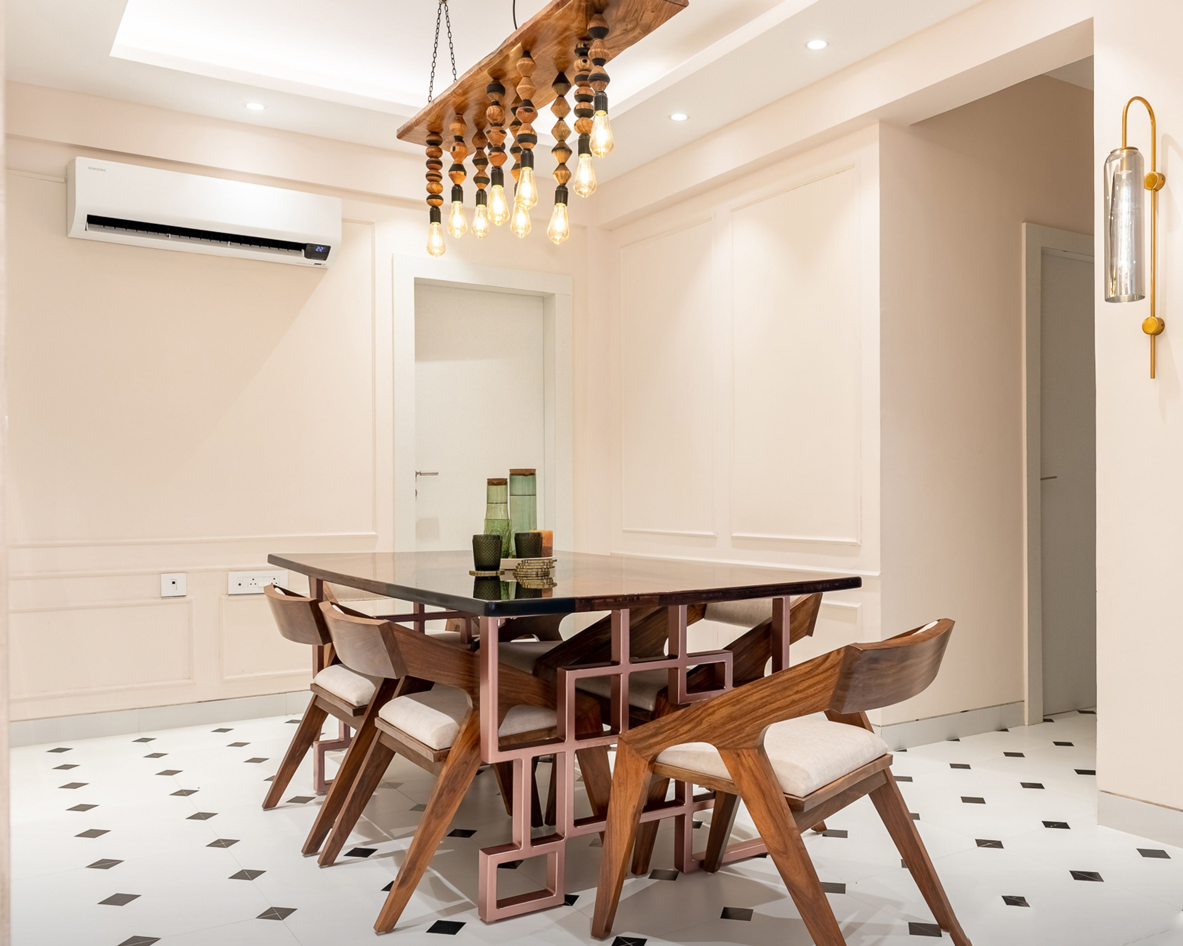 8-Seater Wooden Dining Room Design With Ornamental Chandelier - Livspace