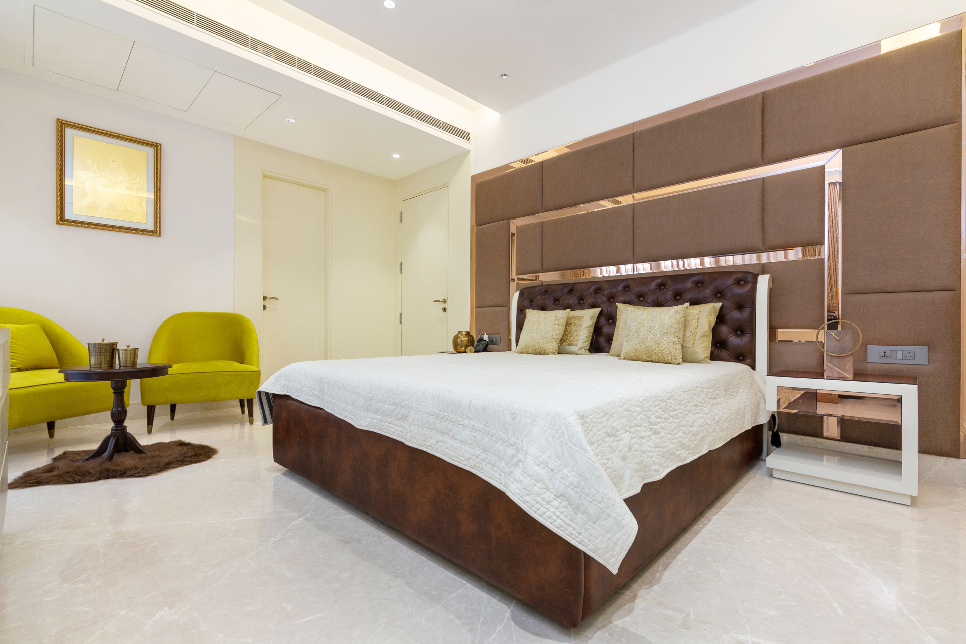 Master Bedroom Design With Huge Brown Tufted Back Panel - Livspace