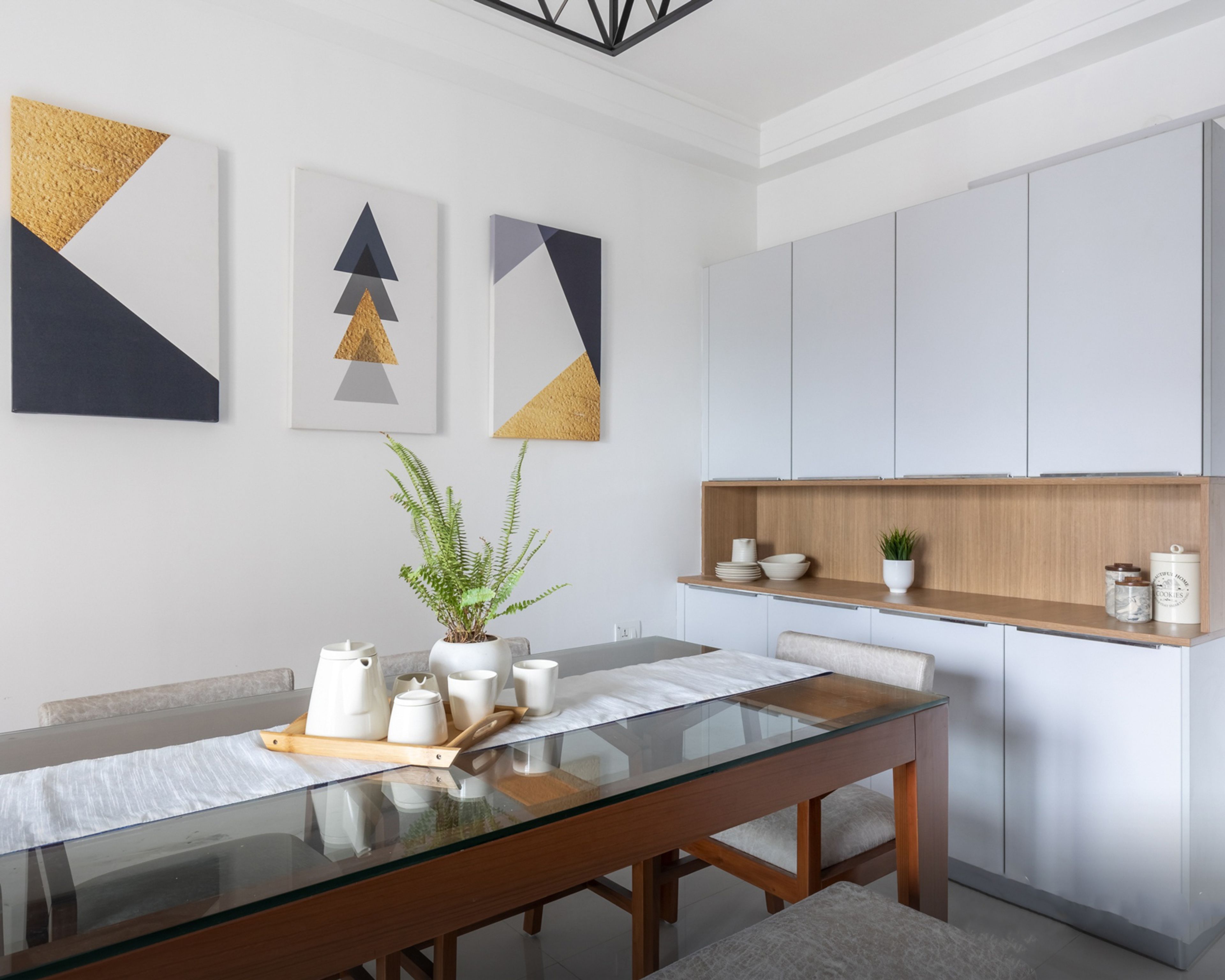 Dining Room Design With Wood And White Storage Unit - Livspace
