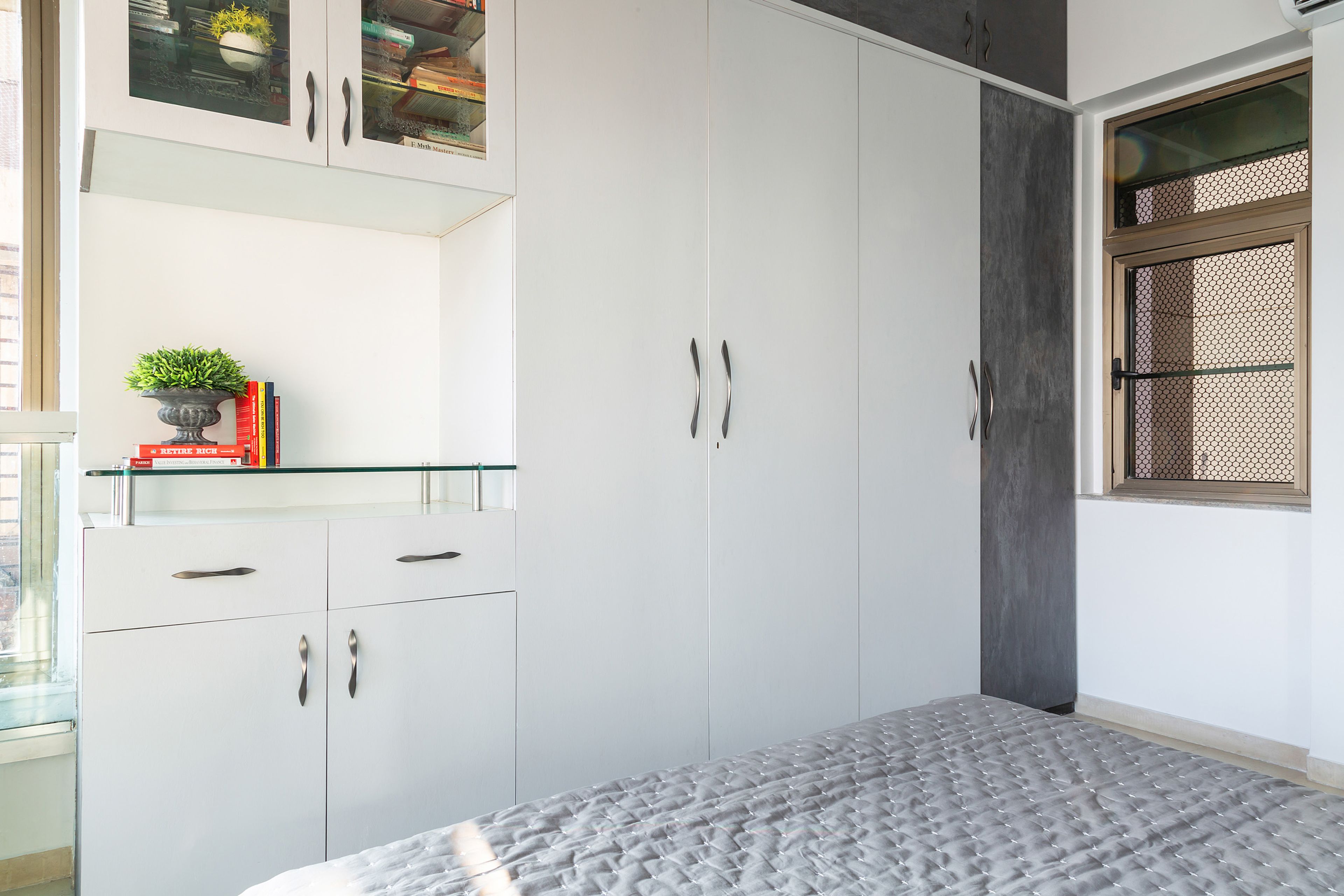 White And Grey Swing Wardrobe Design With Loft Storage - Livspace