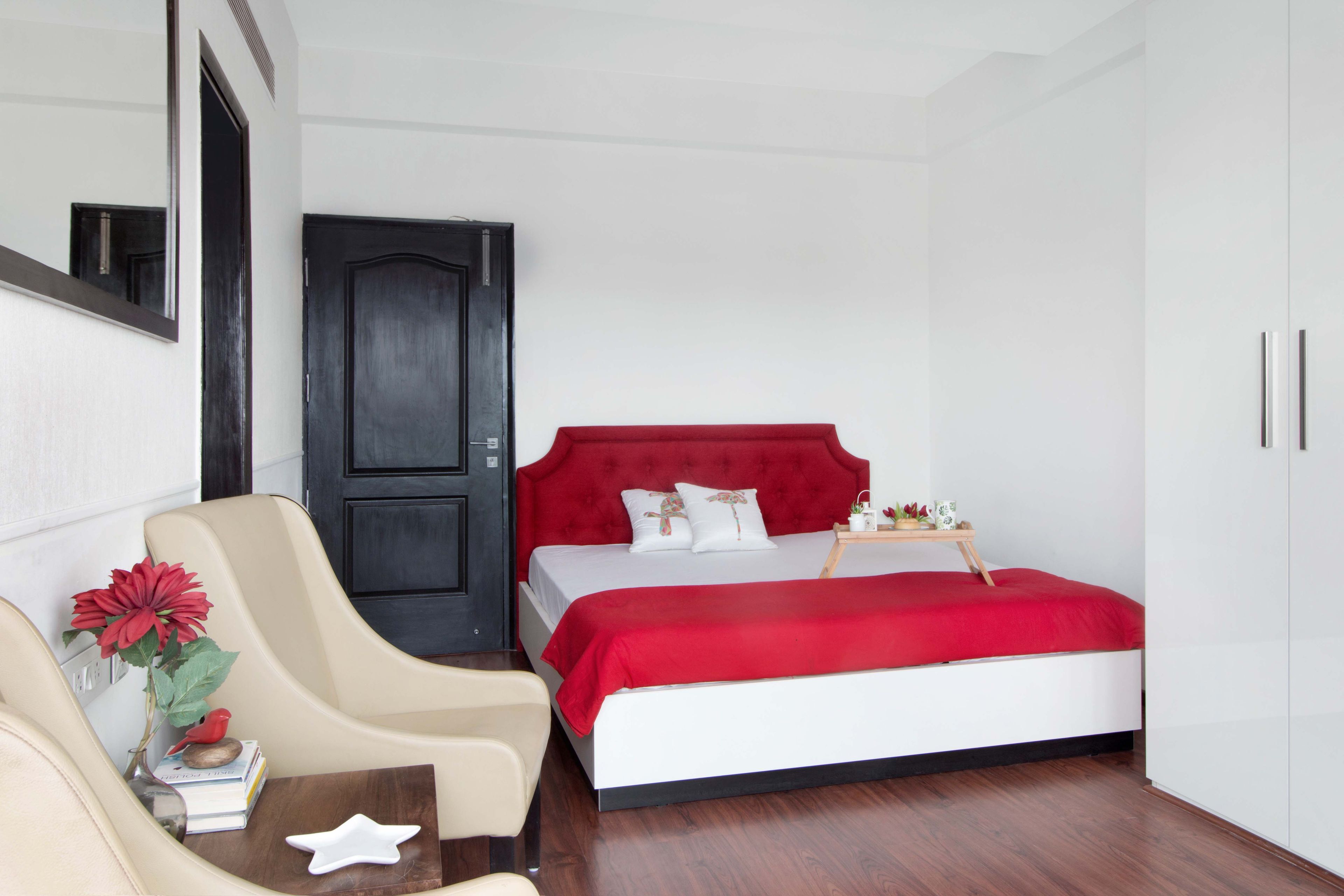 White Master Bedroom Design With Red Tufted Headboard - Livspace