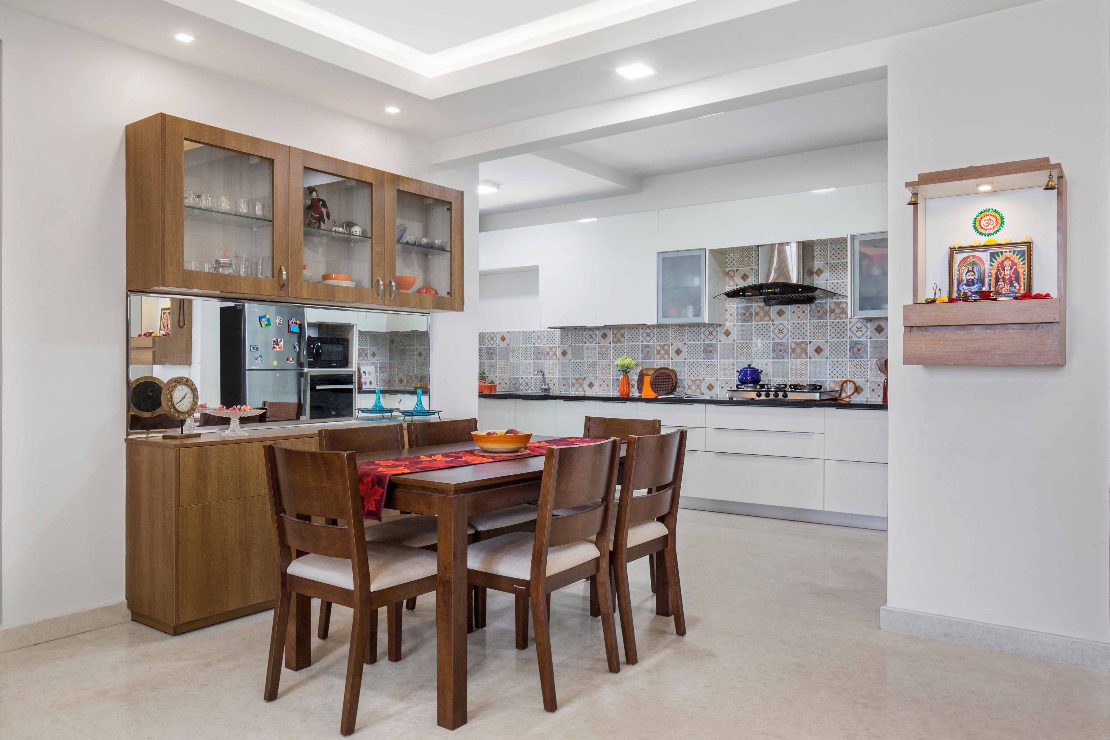 6-seater wooden dining room design with storage cabinet - Livspace